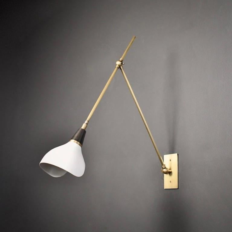 The Torno wall lamp or reading light is handmade to order. Torno is adjustable to suit your needs: it has two articulating joints and the shade has a swivel mechanism for rotation. This design is strongly influenced by both French and Italian
