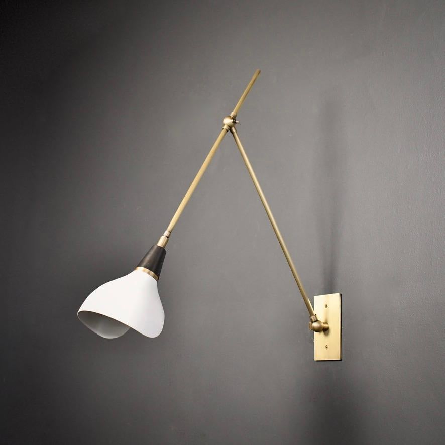 The Torno wall lamp or reading light is handmade to order by Blueprint Lighting. Torno is adjustable to suit your needs: there are two articulating joints and the shade has a swivel mechanism for rotation. This design is strongly influenced by both