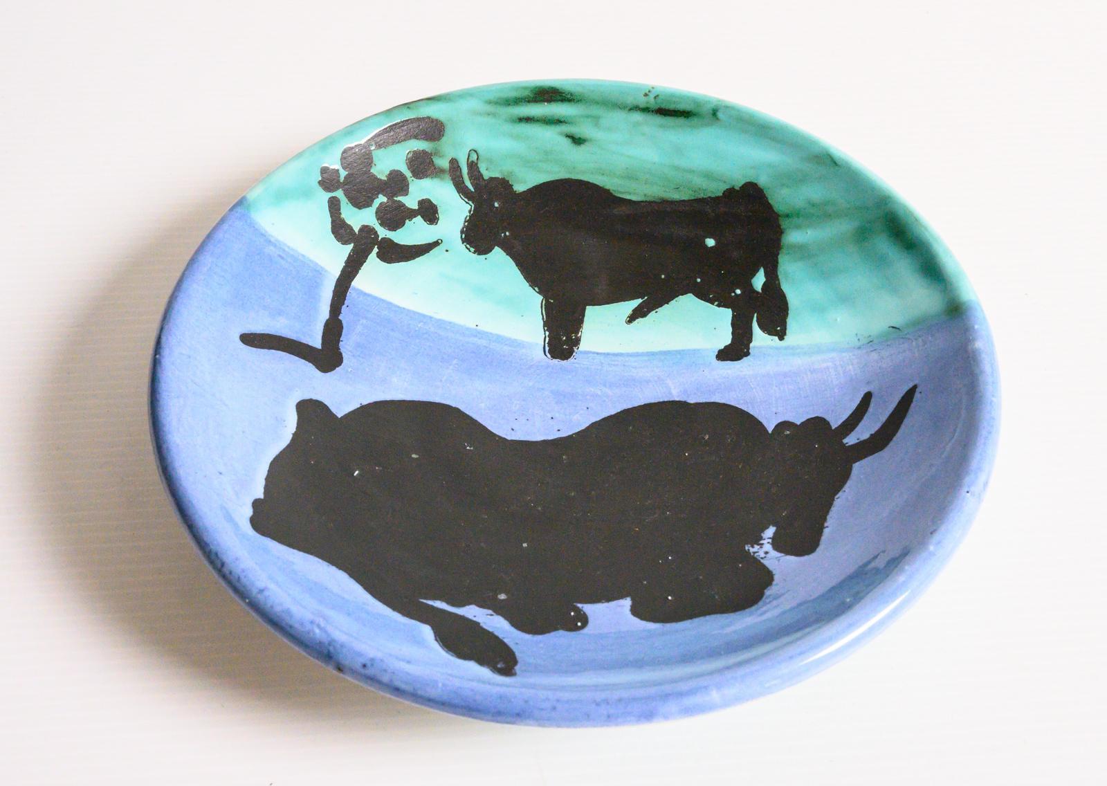 Glazed ceramic plate by Pablo Picasso. White earthenware clay, decorated in underglaze blue, green and black. Marked and stamped “Madoura Plein feu” and “Edition Picasso” underneath, in a edition of 500 edition Picasso/Madoura. Alain Ramié N°161.