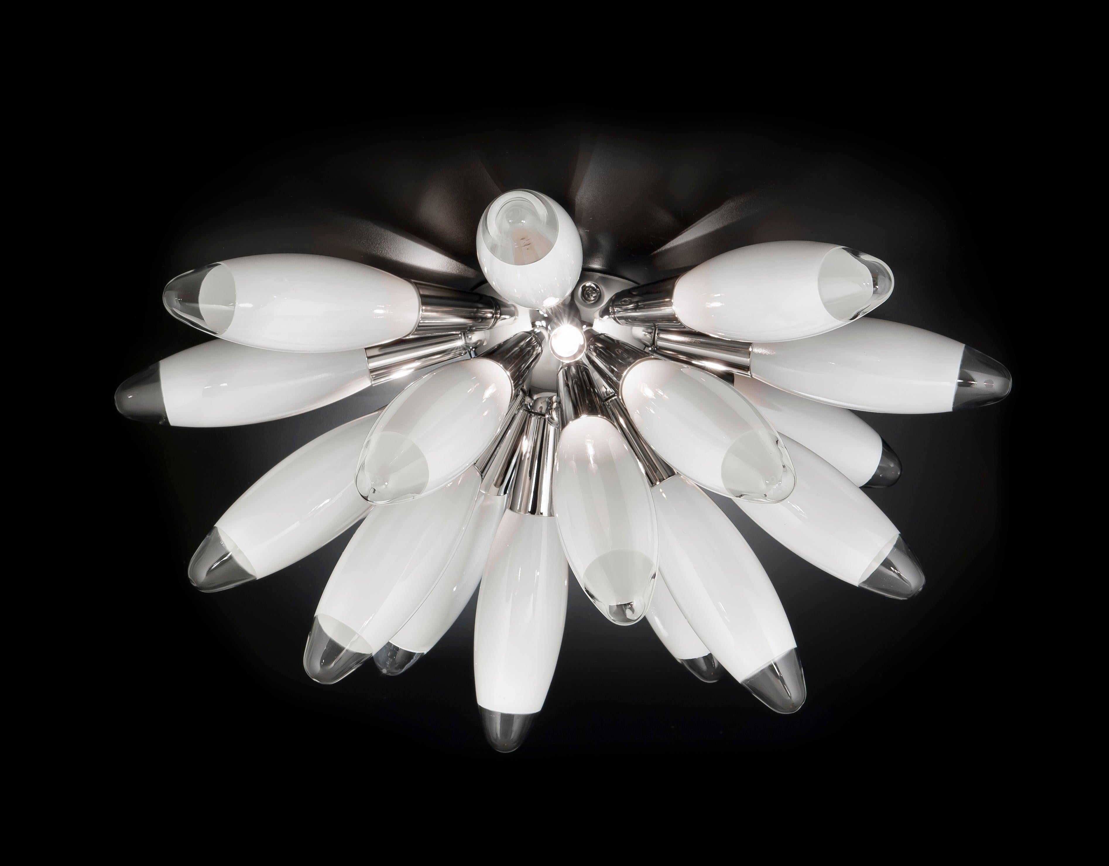 Italian torpedo half Sputnik chandelier with 18 white blown glasses, mounted on chrome finish metal frame / Designed by Fabio Bergomi for Fabio Ltd / Made in Italy
3 lights / G9 type / max 40W each
Measures: Diameter 21.5 inches / height 10