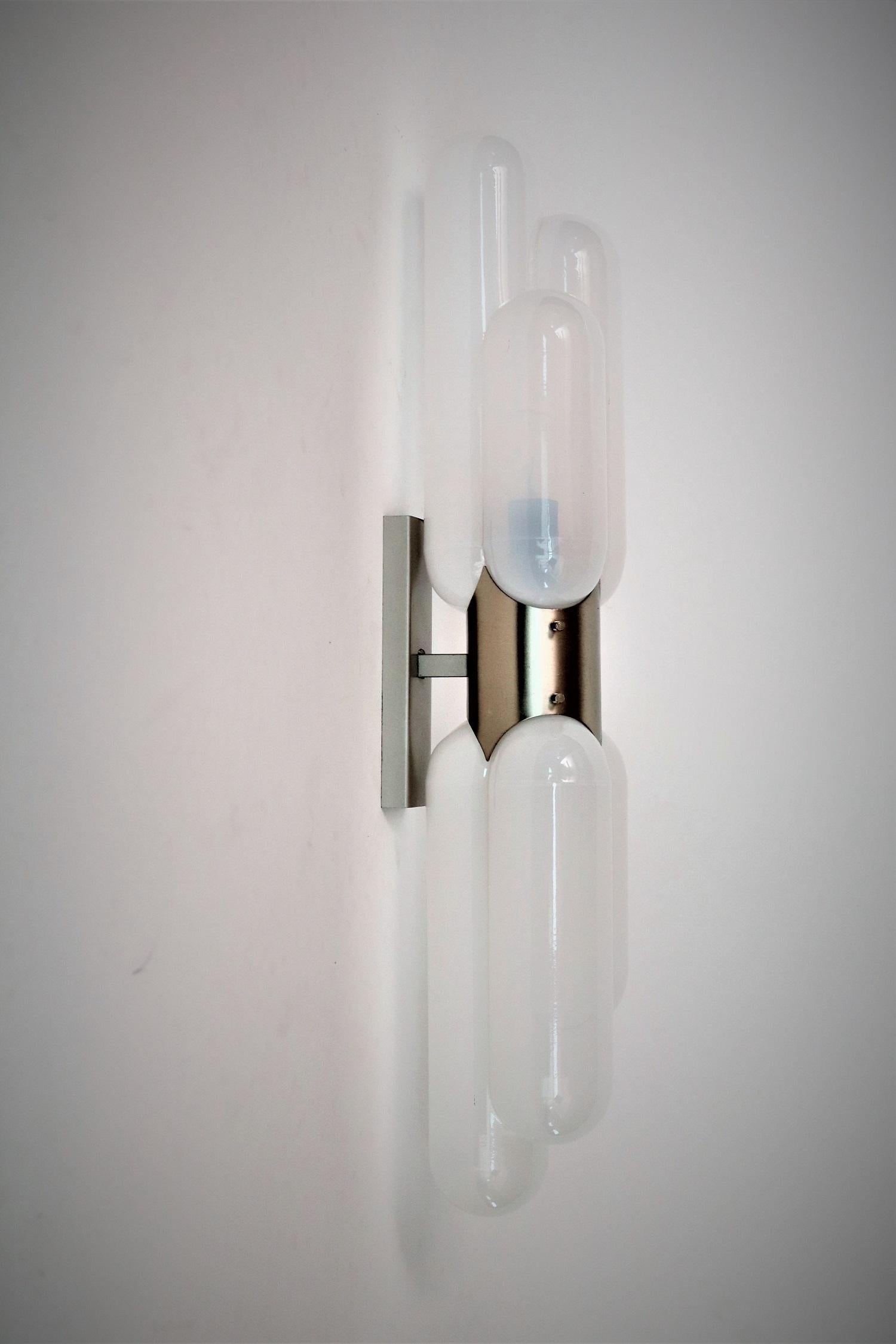 Gorgeous wall sconce made of beautiful opalescent white Murano glass and nickel wall bracket.
Designed by Carlo Nason and manufactured by Mazzega in the 1960s, Italy.
The light is called 