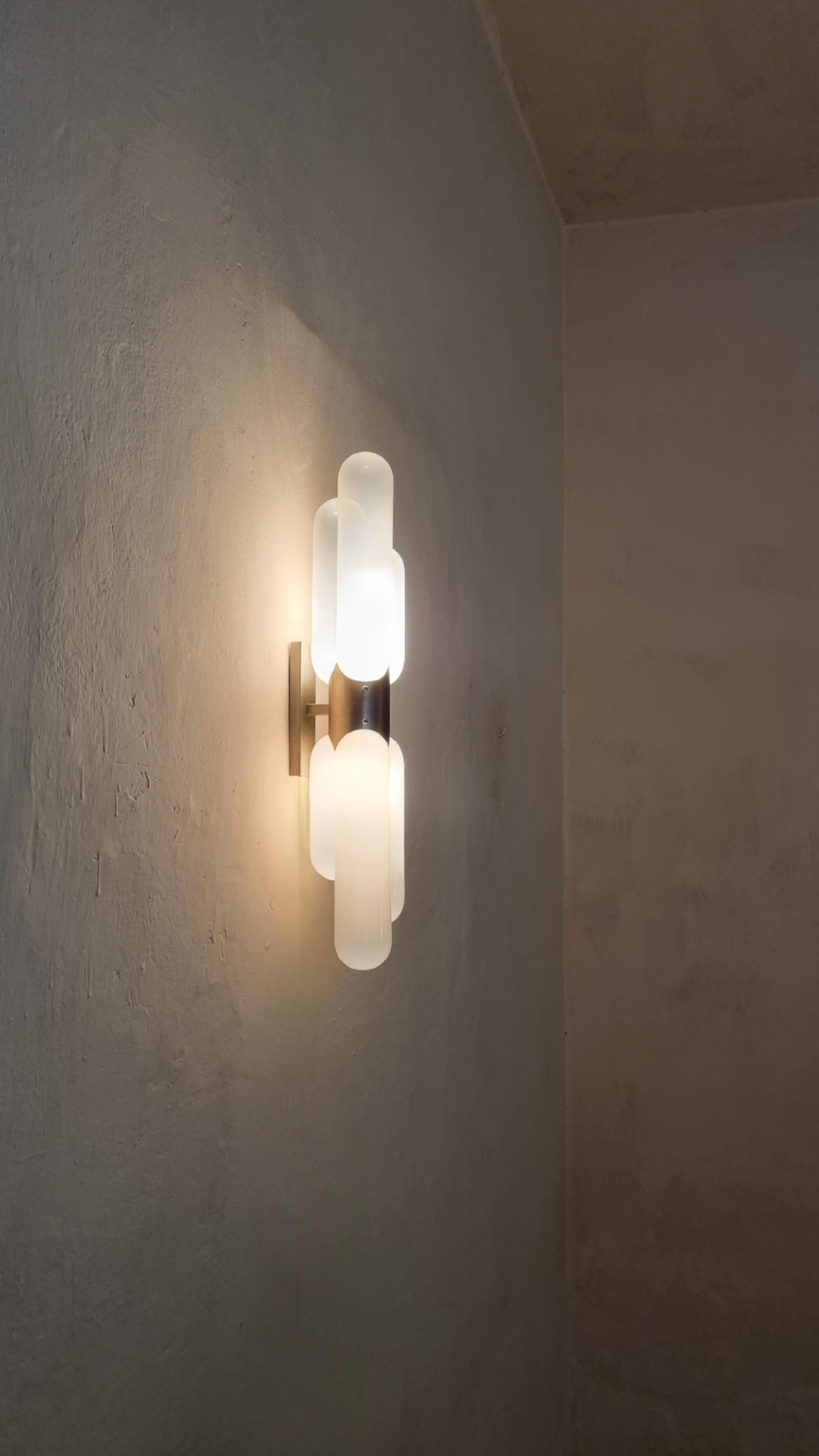 Large wall sconce designed by Carlo Nason for Mazzega, Italy 1960s.
Brushed metal structure, opal glass diffuser.
Excellent condition.

Mazzega’s origins date back to 1946 in Murano, the island of glass tradition, where the company still produces