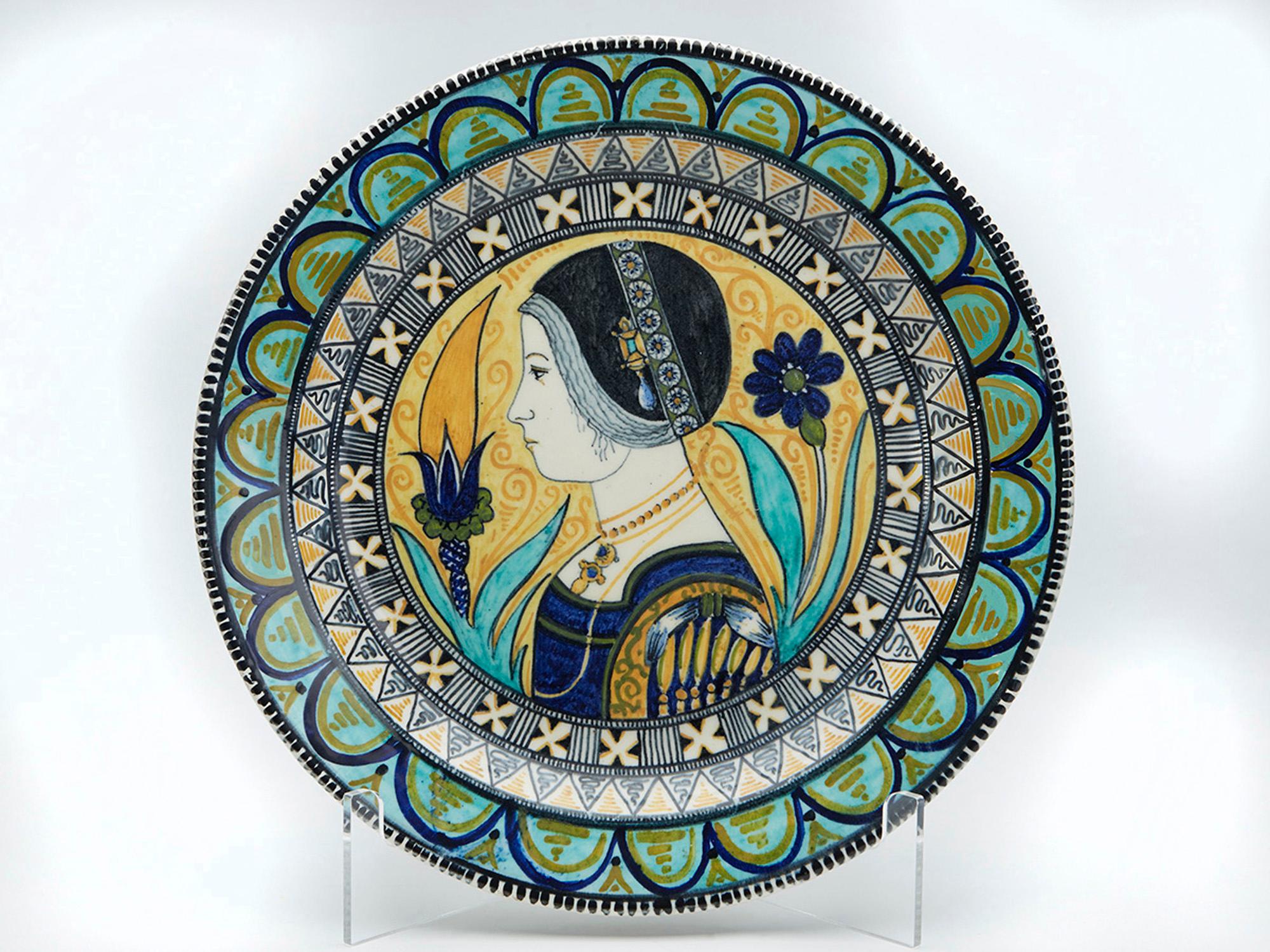 An exceptional Italian Renaissance revival maiolica tin-glazed charger painted with a side profile portrait of a lady manufactured in Rome by Torquato Castellani and dated 1881.

Maiolica (or majolica) is a term traditionally applied to a type of