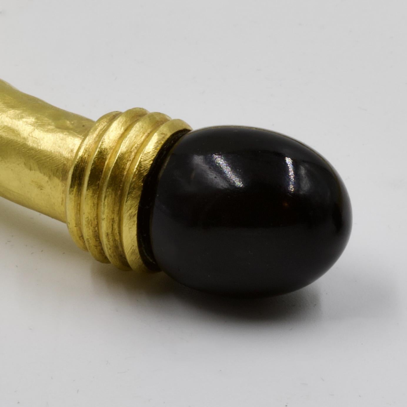 Antiker Drehspiritus, Amati-Gold, mit 2 Kugeln aus schwarzem Onyx, signiert, ca. 1970-1980.                                                                                                               Ilias Lalaounis (1920-2013) verkörpert die