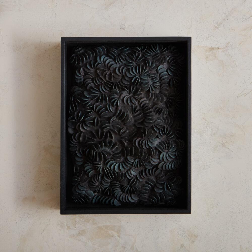 A framed textural wall sculpture made from foam, aqua resin, paper and ink on board by Canadian artist Erin Vincent. Her work is inspired by the beauty and simplicity of nature and reflect organic formations such as water currents and rock