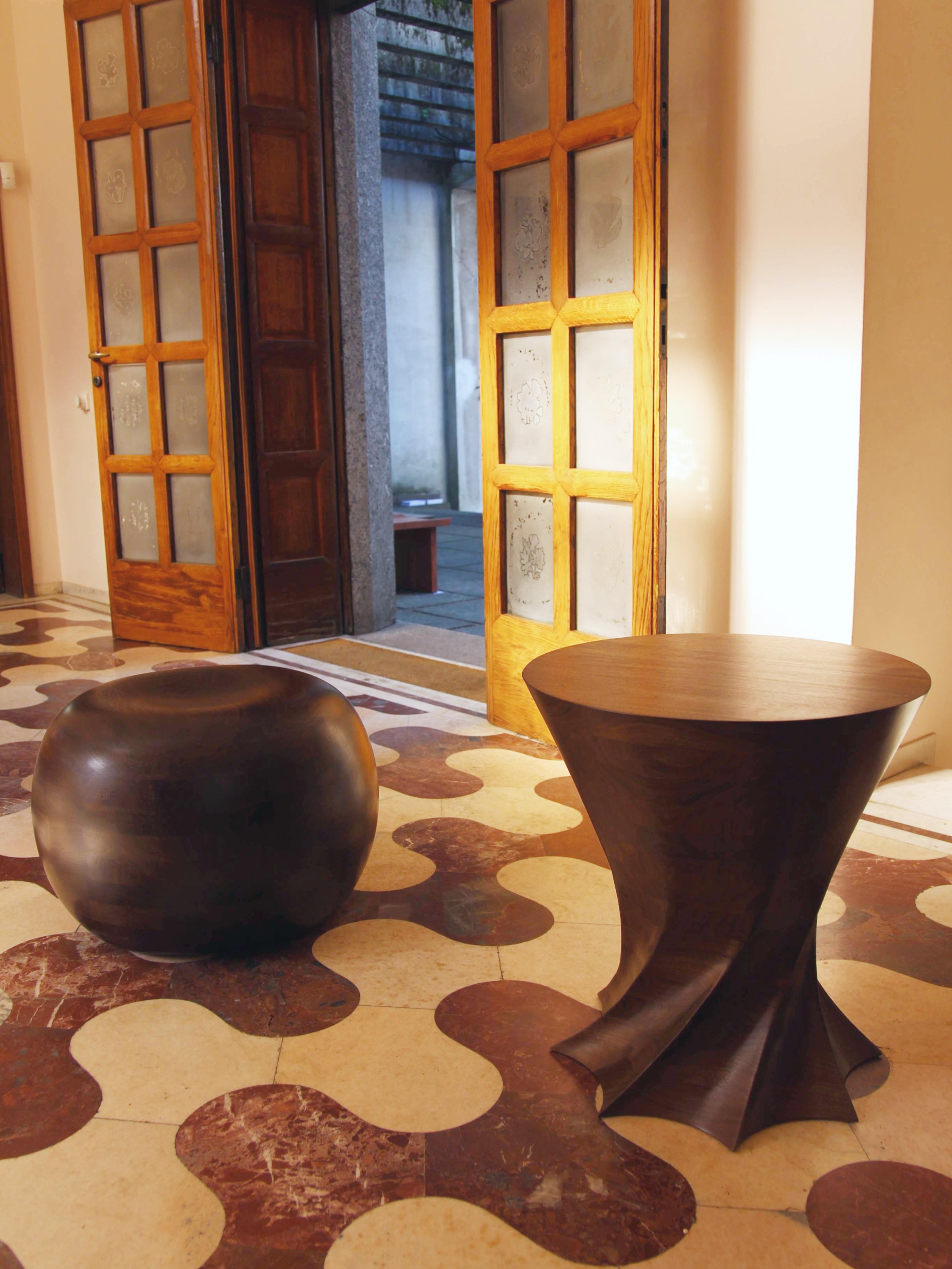 Torque Walnut Side Table by Studio TOOJ
Designed by Johan Wilén
Dimensions: D 44 x H 51 cm.
Materials: Walnut wood.

A true testament to the designer’s signature style, redefining what we understand as the beauty of simplicity. Exquisite solid wood