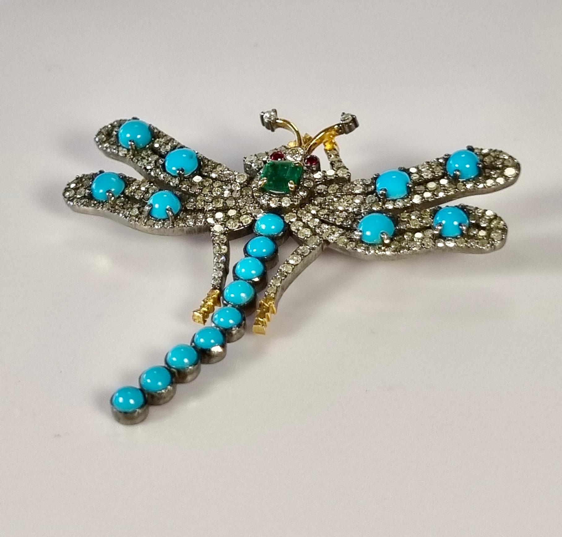 Torquoise Dragonfly   14k Gold and silver Brooche with Diamonds and Emerald
14k gold  2gr
Silver 10.08gr
Diamonds 2.56ct. 
Emerald 0.29ct
Rubies 0.02ct
Turquoise 2.43ct 

READY TO SHIP
*Shipment of this piece is not affected by COVID-19. Orders