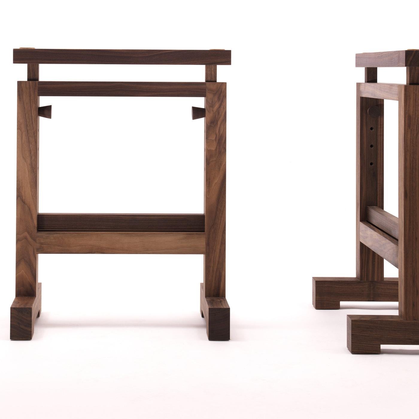 Simple yet sophisticated, this trestle-base is entirely made of solid wood that is treated with linseed oil and beeswax to enhance the natural grain of the wood. The trestle features a frame with two solid legs and transverse feet as well as