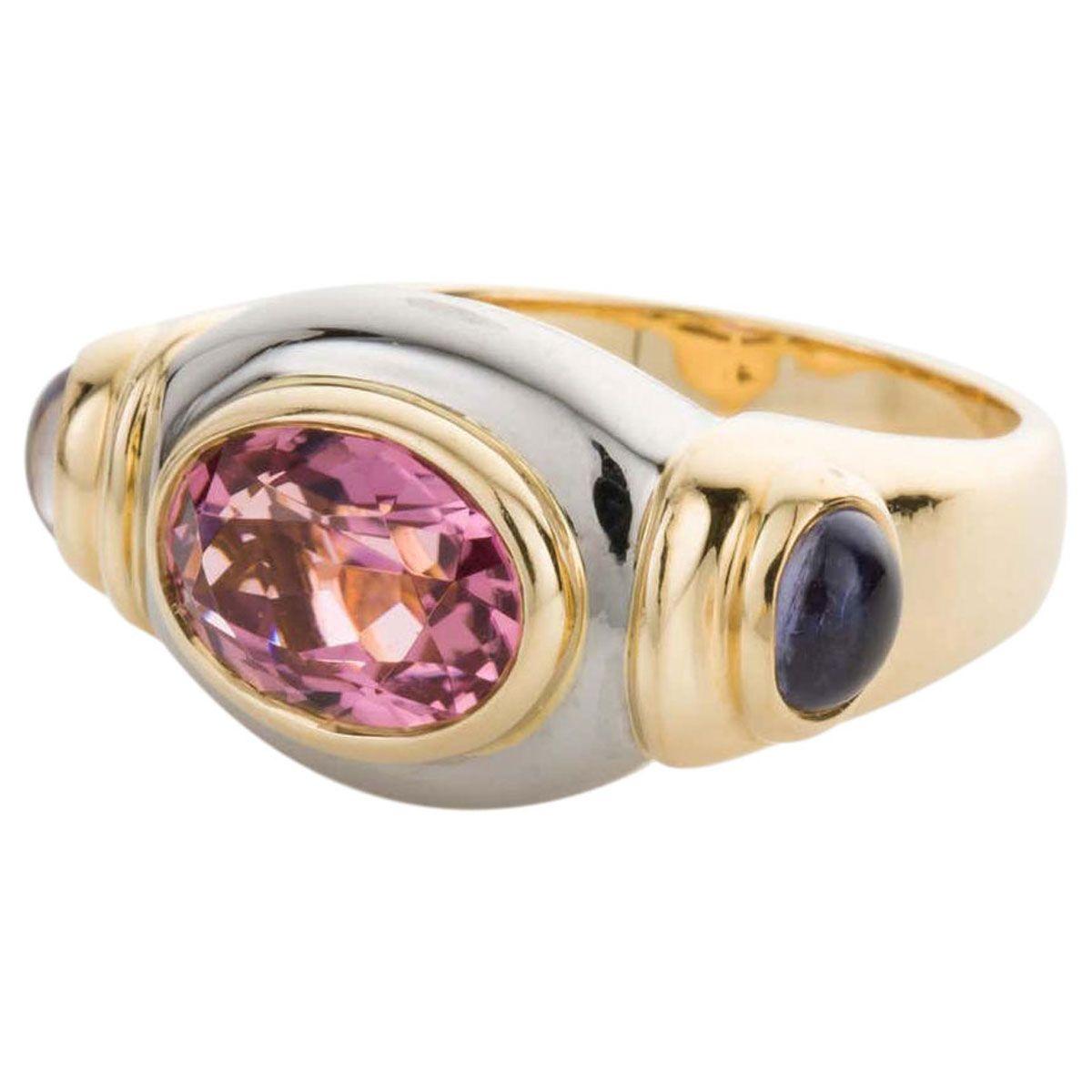 A bold look on the finger but still has elegance with its rounded lines and beautiful gemstones. A precisely faceted pink tourmaline sits as the centre piece in this Italian beauty. Weighing approximately 2.15cts this oval cut gemstone has a certain