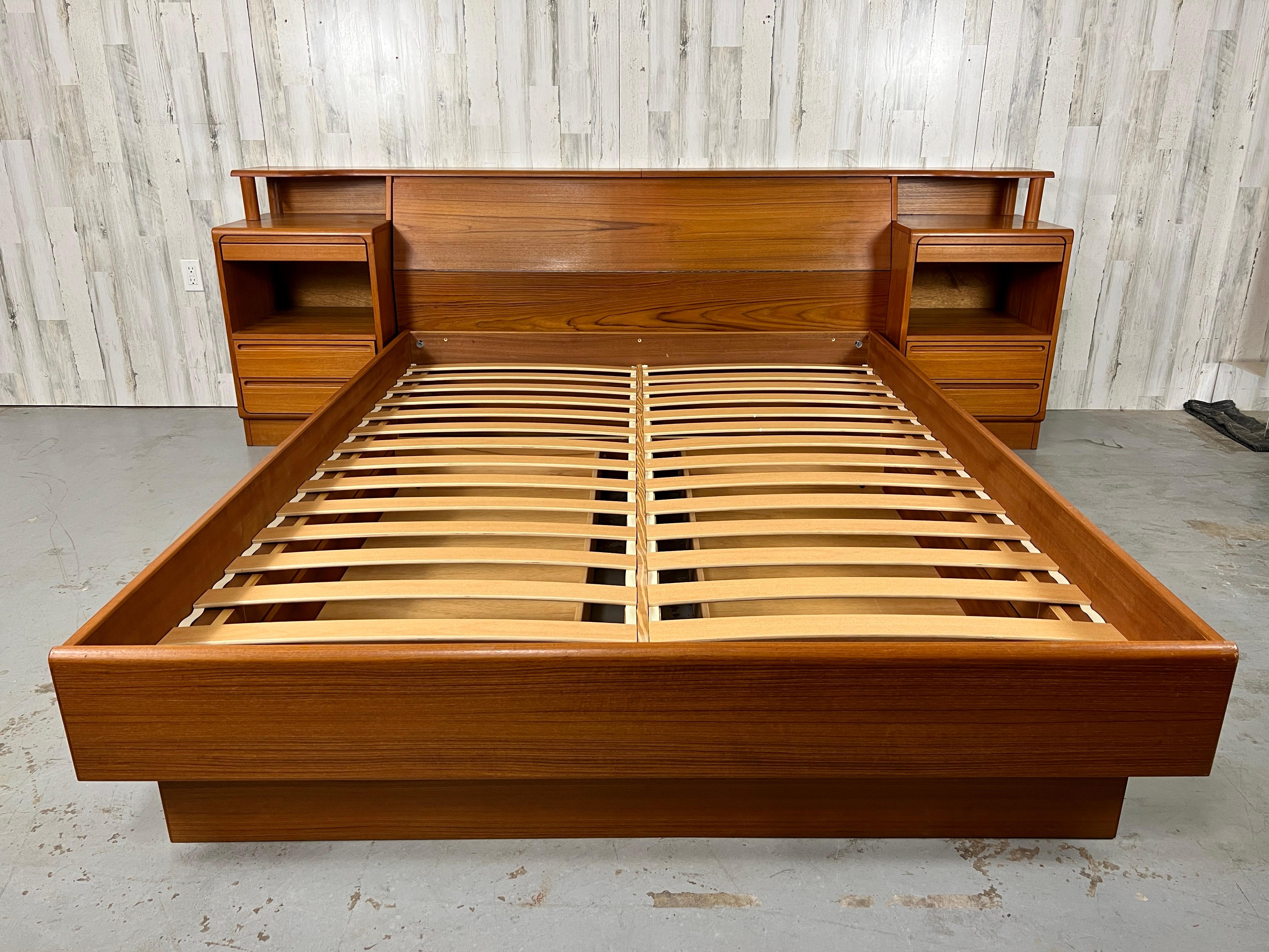 Torring Mobelfabrik Teak Queen Sized Storage Bed. Massive amounts of storage underneath the bed, inside the headboard, and drawers in the nighstands. Pull out tray tables in the nightstands perfect for reading a book or your morning cup of coffee.