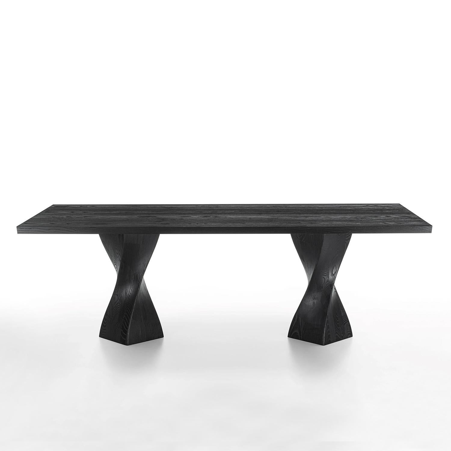 Dining Table Torsade Black with top made with 
blockboard veneered ash with bevelled edges
in black pigmented finiish.
With 2 feet in solid ash in black pigmented finish.
Also available in:
L220xD100xH75cm, price: 9400,00€
L240xD100xH75cm,