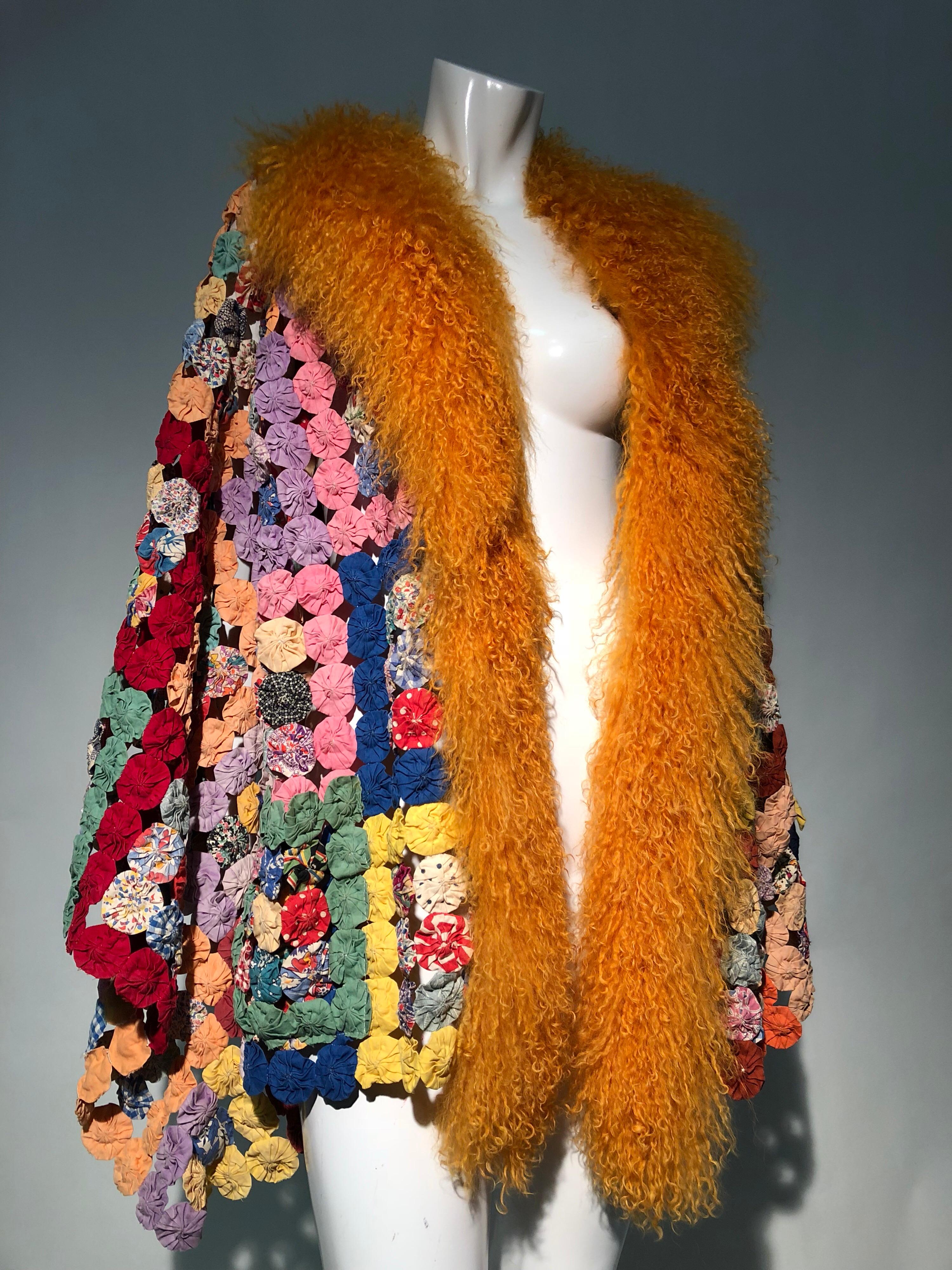 Torso Creations 1930s yo-yo quilt Art-To-Wear, flare-sleeve jacket or robe with orange Mongolian fur collar. Side patch pockets. A beautiful antique, hand-made textile transformed into a bold Bohemian look! No closures.