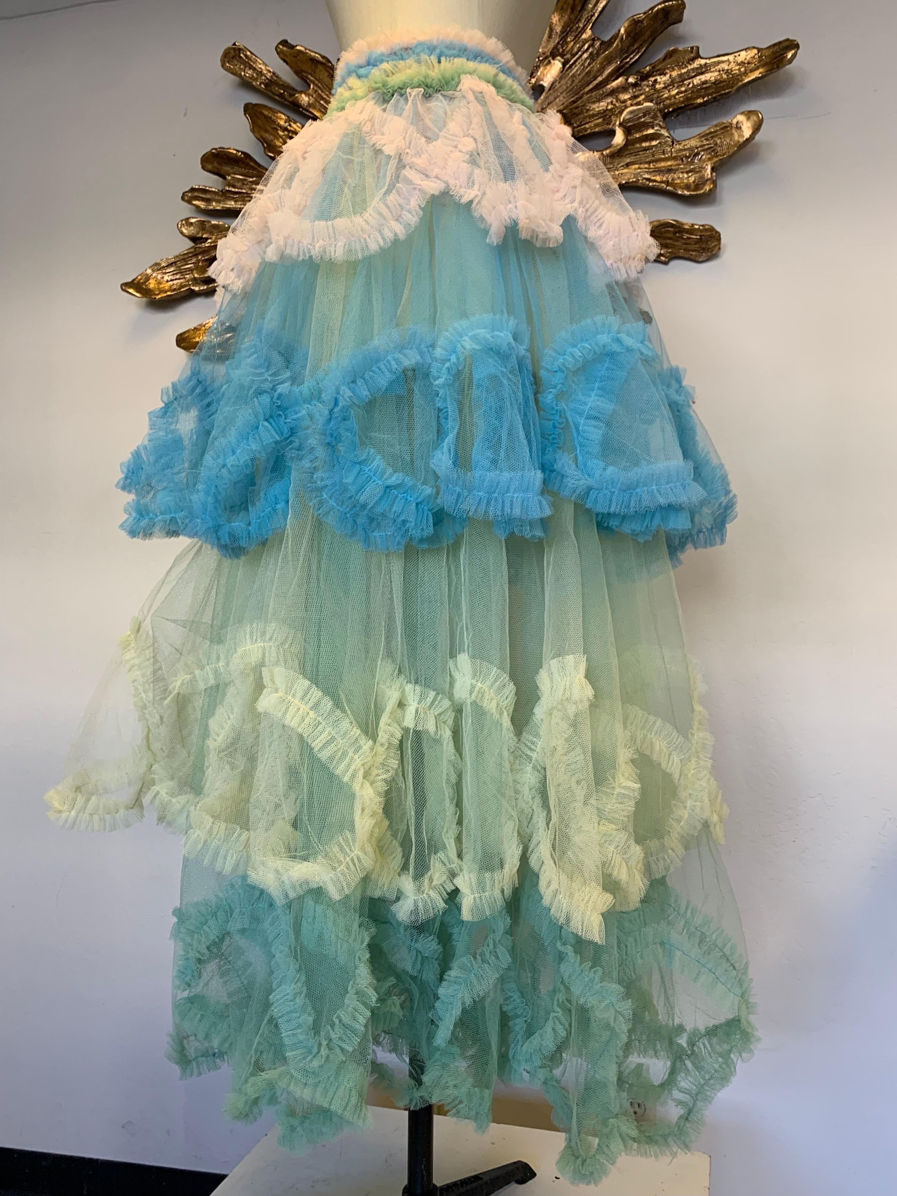 Torso Creations redesigned 1950s-inspired ball skirt in beautiful pastel candy colors. Lined to the hip with side or back zipper. 4 graduated layers of voluminous tulle with undulating ruffle embellishment. Elastic and zip closure. Size small to