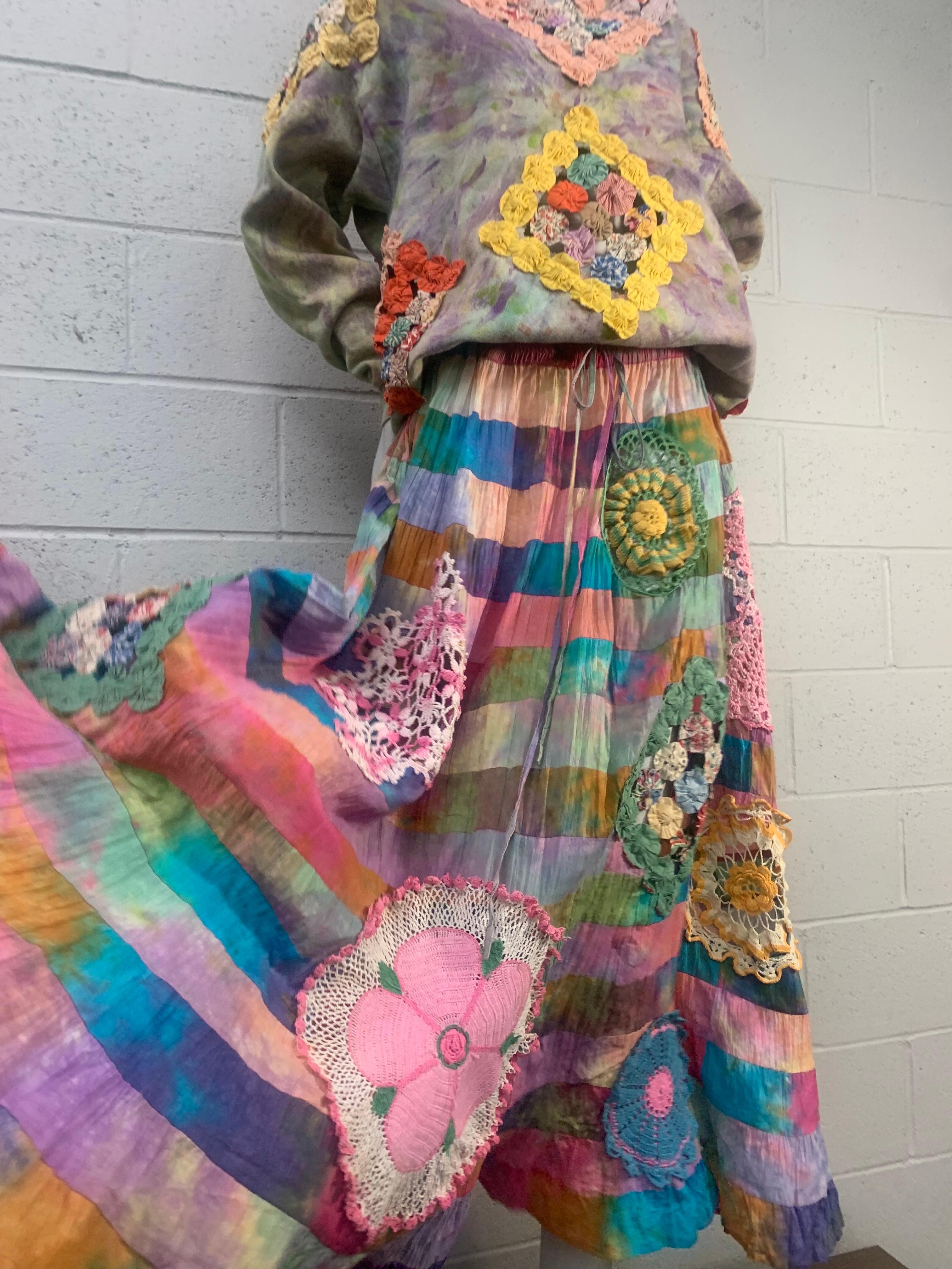 Torso Creations 2-Piece Cotton Tie Dye Patchwork Crochet Quilted Skirt & Pullover Set:  Skirt is a full tiered and gathered patchwork floor-length skirt with colorful crochet inset panels. Top is tie-dyed cotton pullover with yoyo quilt peek-a-boo