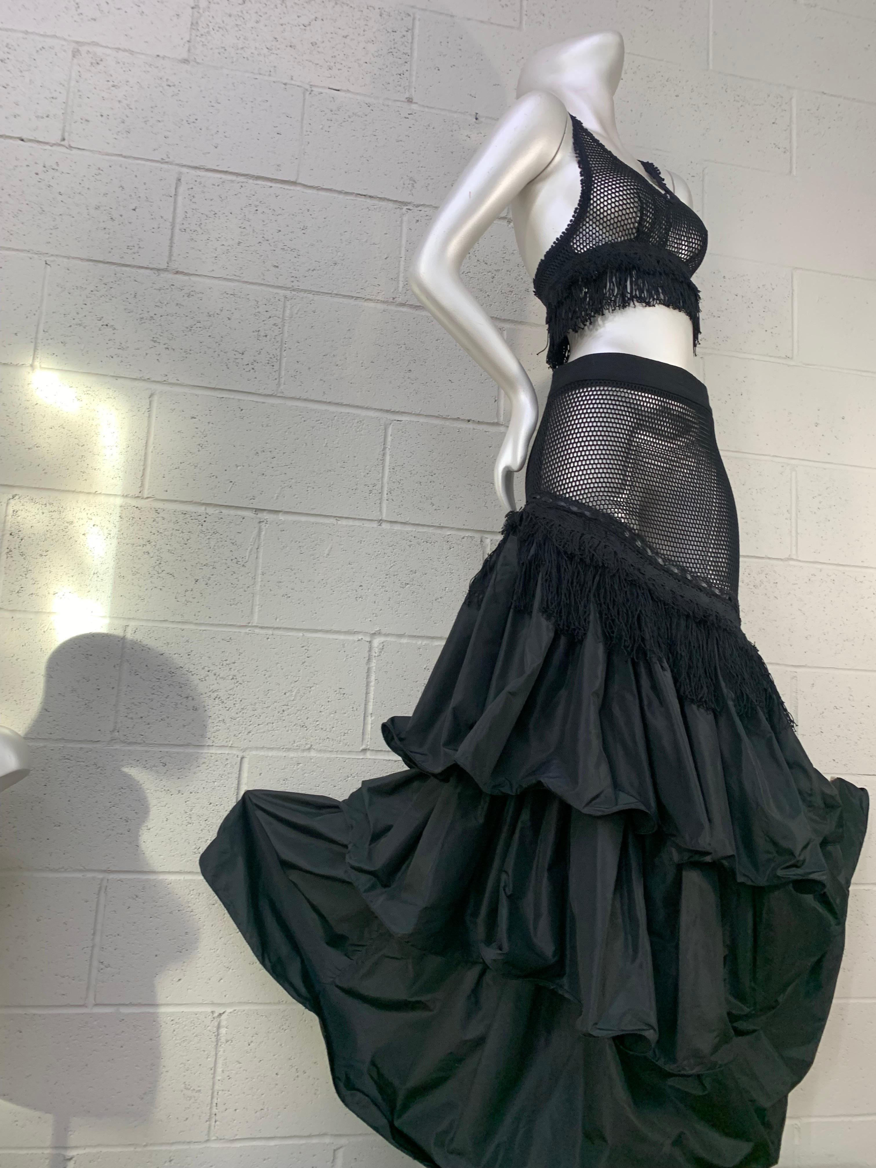 Torso Creations Black 2-Piece Fishnet & Silk Taffeta Tiered Flamenco Skirt & Top:  Burlesque-inspired black fishnet cropped top is trimmed in fringe with racer back styling. Skirt is a provacative mix of fishnet and lush tiered silk taffeta ruffles.