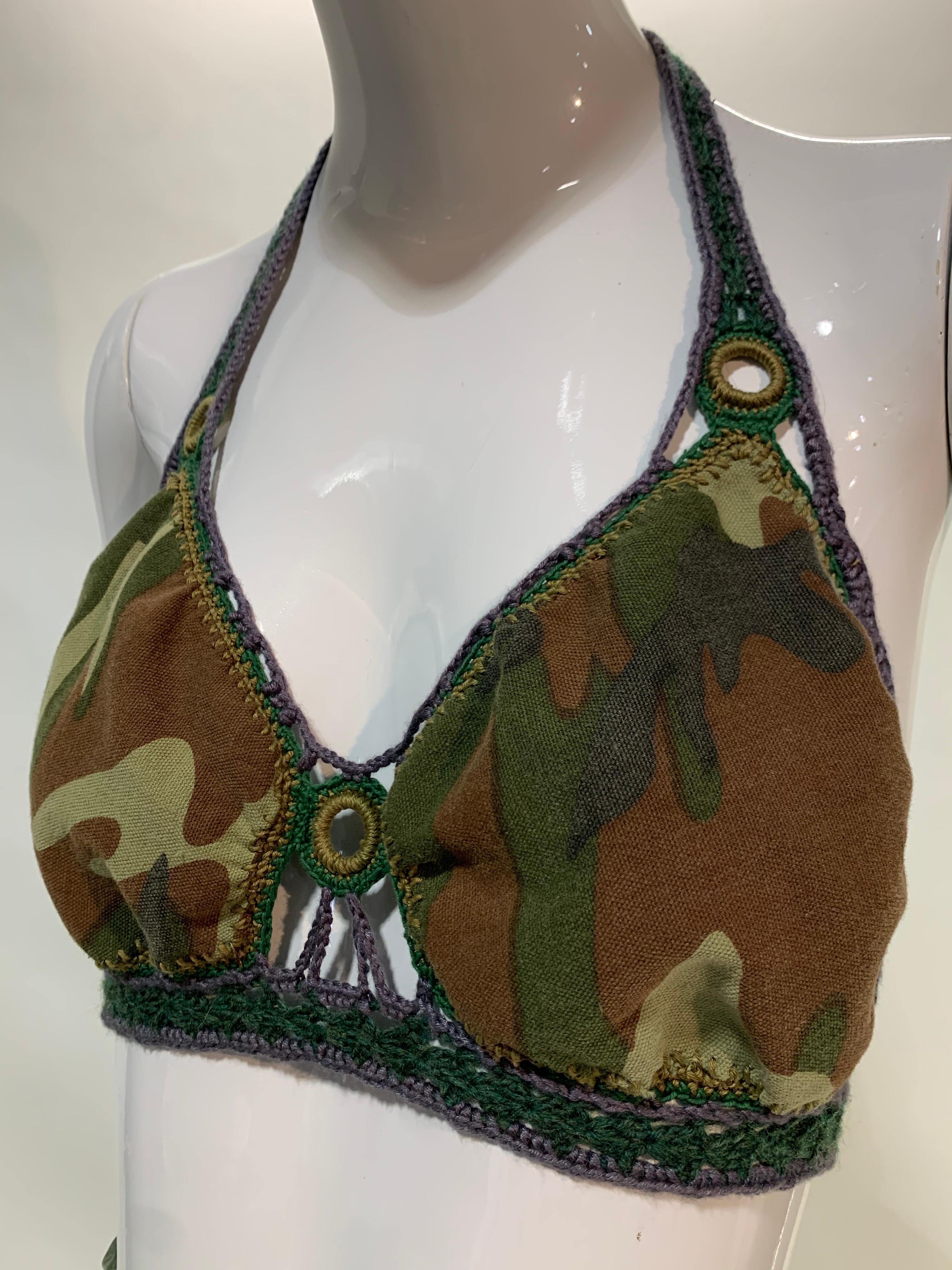 Torso Creations camouflage-print cotton bralette with hand-crochet peek-a-boo ring detailing. Ties at  neck and back to accommodate up to a Medium size. A crafty art-to-wear twist on military from our Spring/Summer 2022 Collection. 