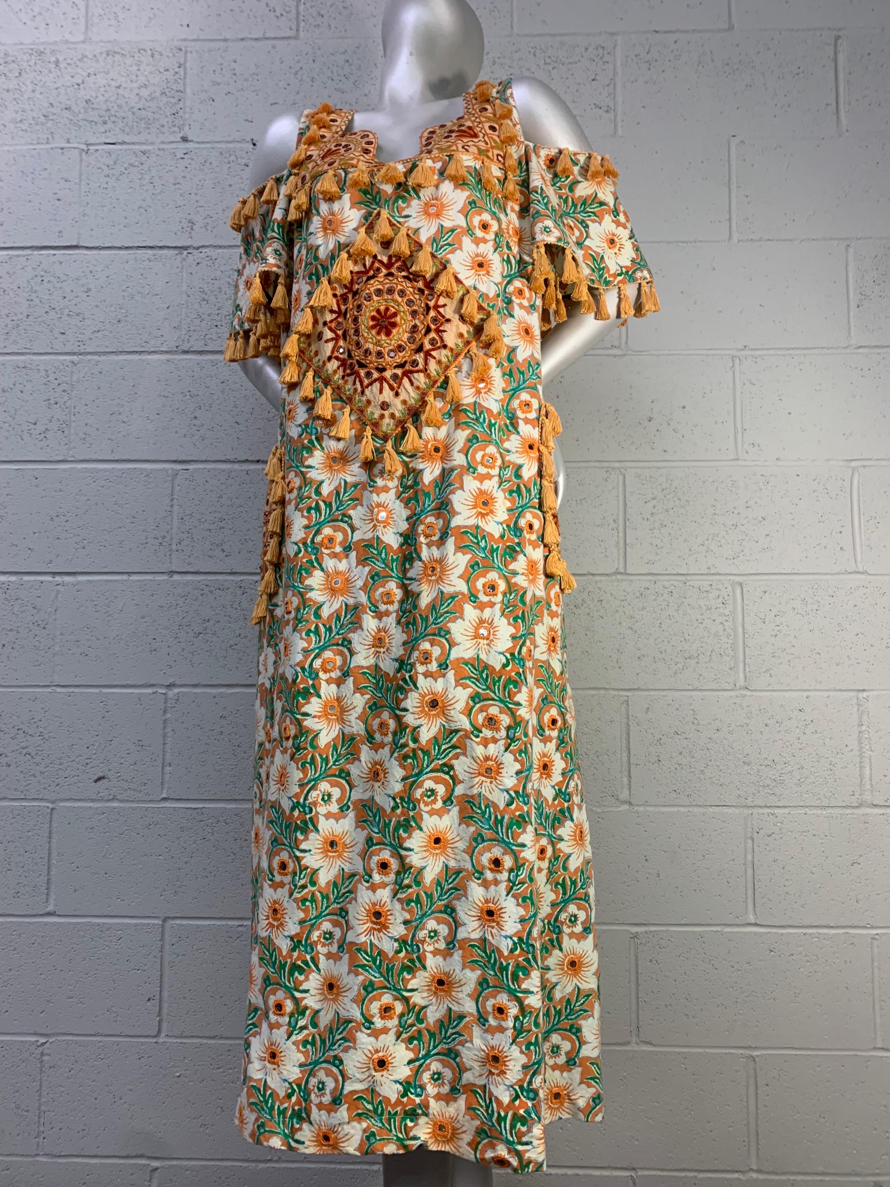 Torso Creations Cotton Lily Print Resort Dress w Mirror Tile and Tassel Fringe: Bare, drop-shoulder sleeves in an A-line silhouette. An original 1970s Ramona Rull dress in white, saffron and sage green stylized florals has been artfully married with