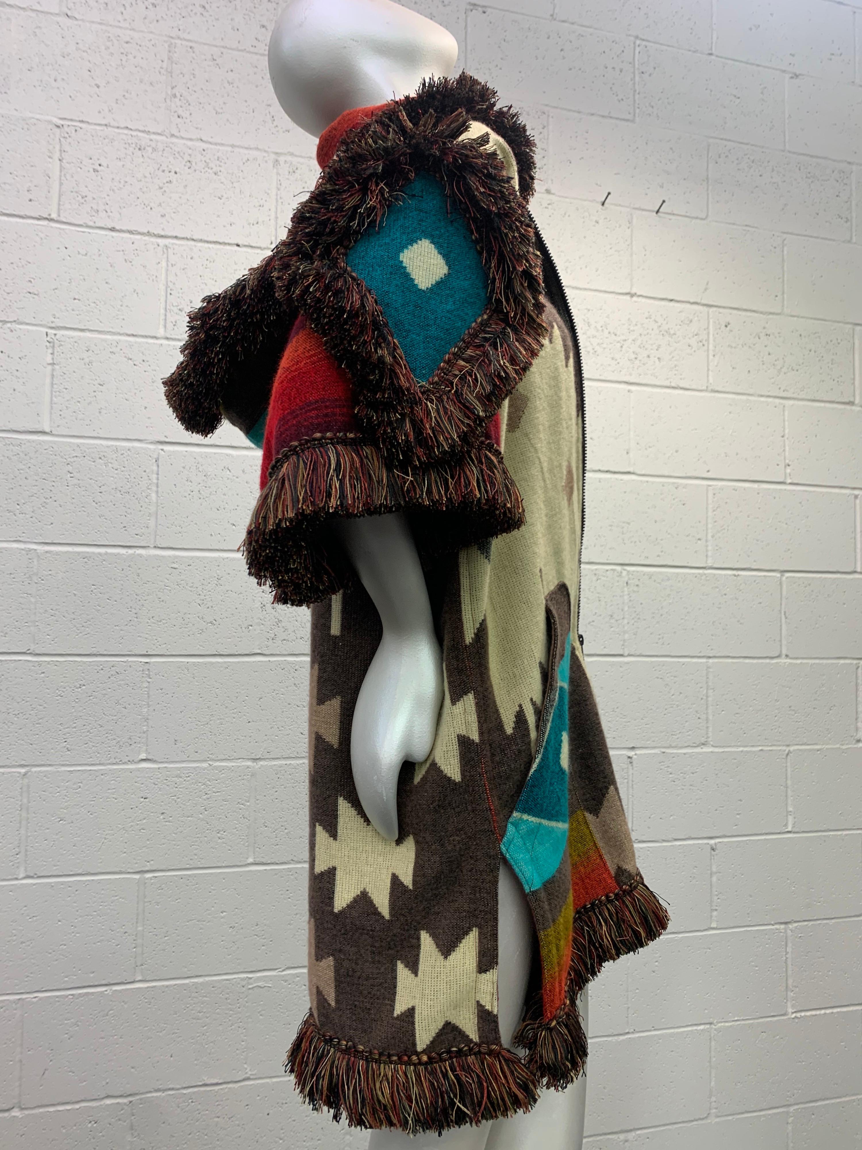 From our Torso Creations atelier comes this Ecuadorian made, ultra-soft woven wool blanket designed into a hooded, double-zip front unisex  jacket with pouch pockets and trimmed in lush ombre rayon fringe .

The bold motif in traditional Ecuadorian