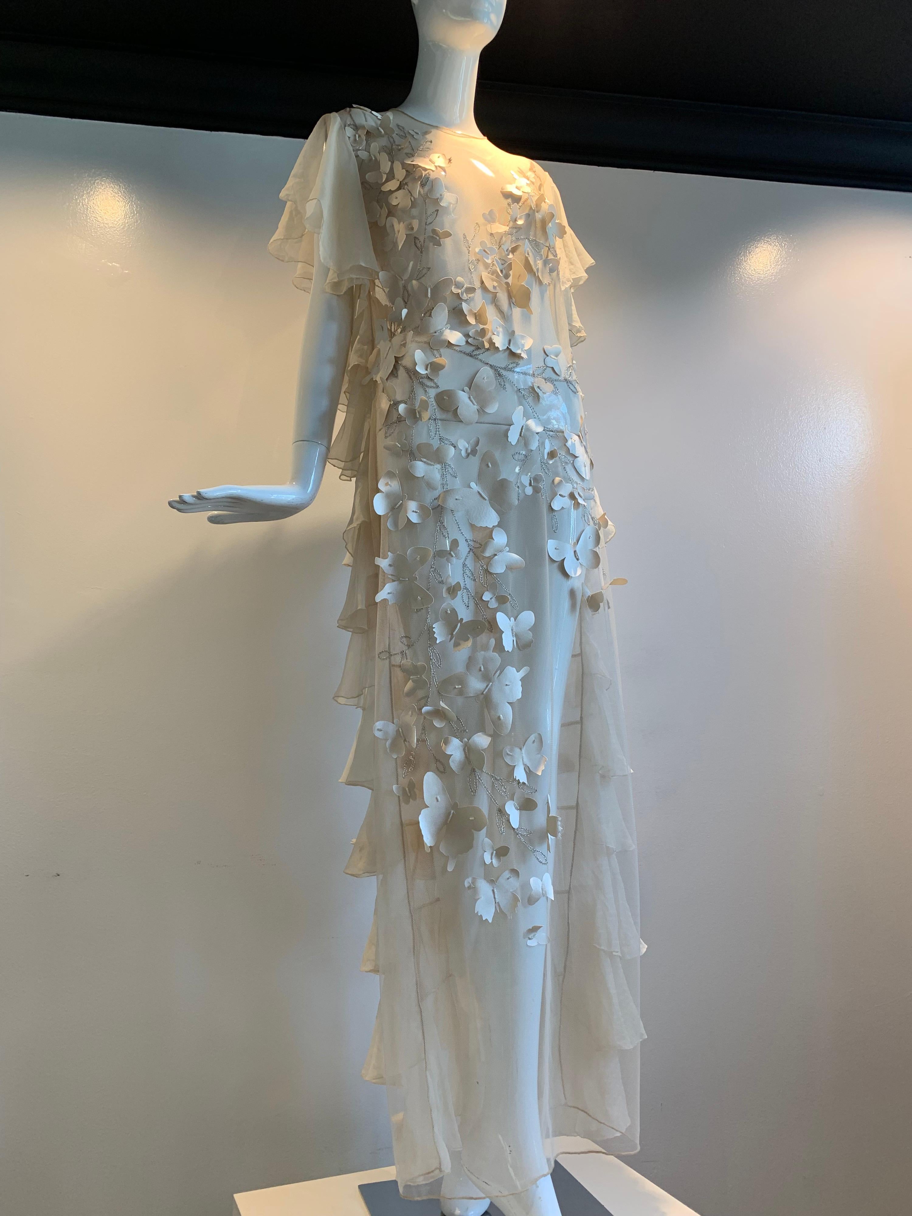 Torso Creations eggshell silk chiffon and tulle ruffled 1930s-inspired fantasy wedding gown with silk butterfly appliqués fashioned from a 1940s satin wedding dress. Front is a flat tulle panel, embroidered with silver branches and adorned with