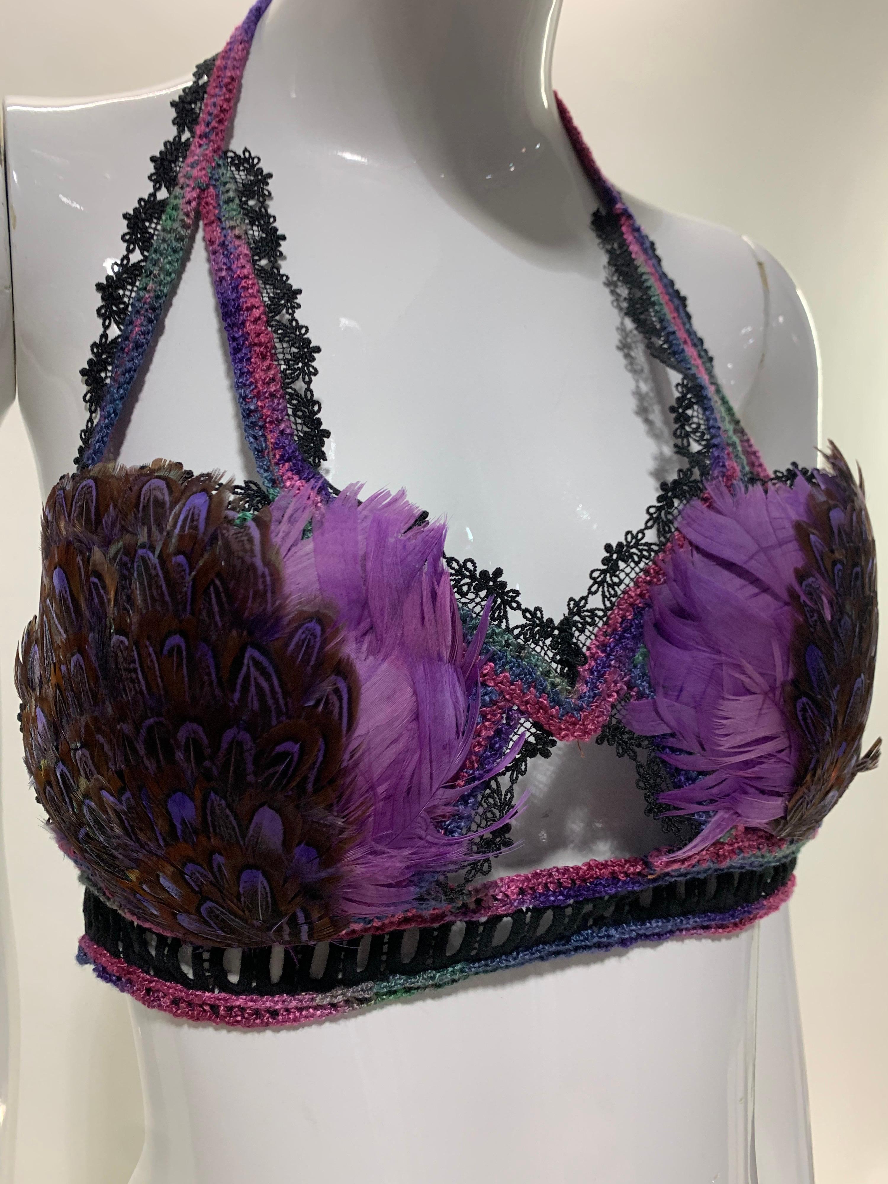 A Torso Creations dyed pheasant feather, lace and crochet bralette in purple, lavender and black. Peek-a-boo front details. Cups are lightly padded and lined in silk. Back and neck tie closure. Fits Medium. 