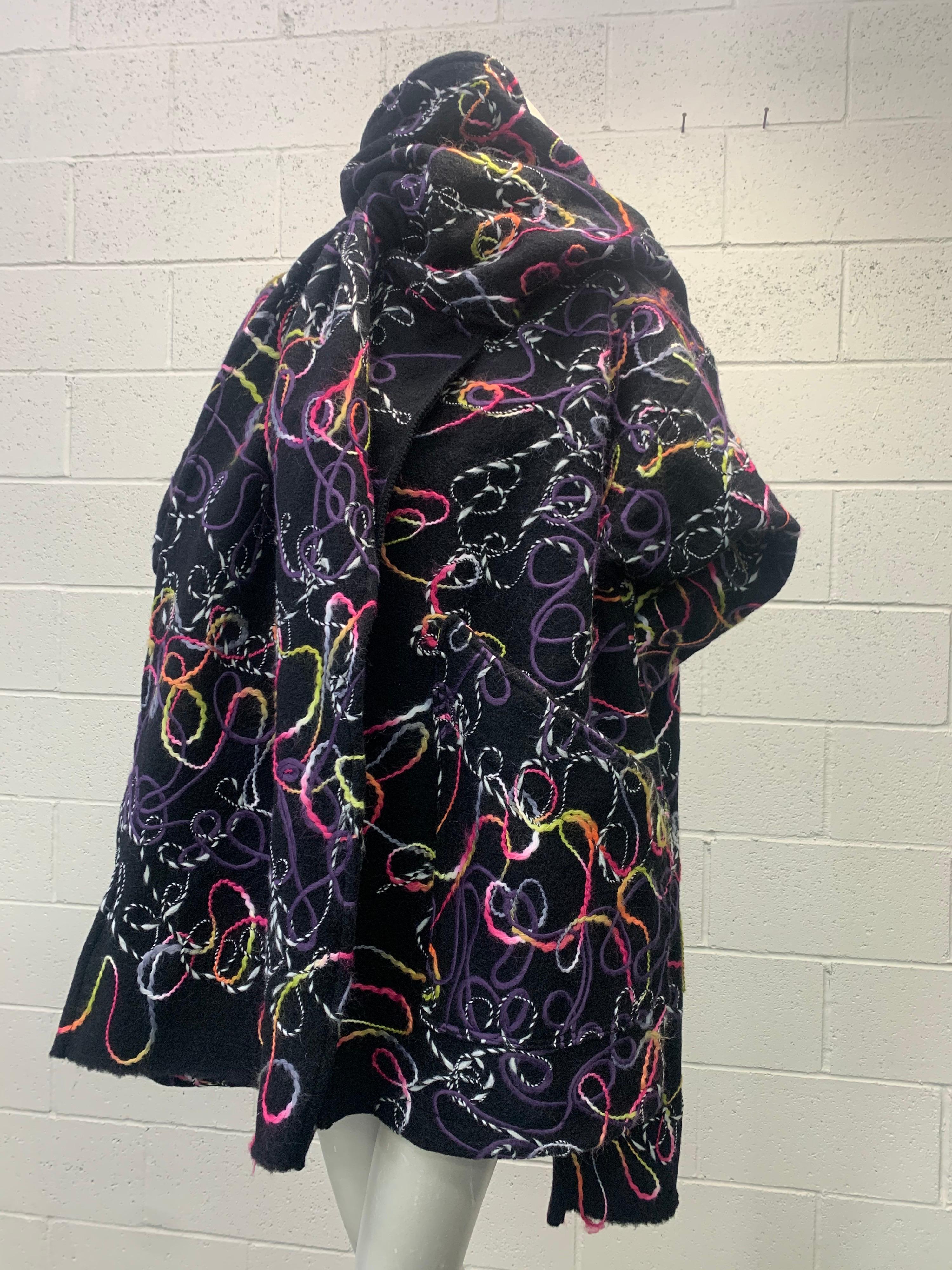 Inspired by the 80's style Torso Creations masterfully designs this over-sized coat from deadstock fabric made in Italy. This heavy felted wool fabric features swirls of vibrant colored woven yarns in pink, lavender, yellow and orange.
 
This coat