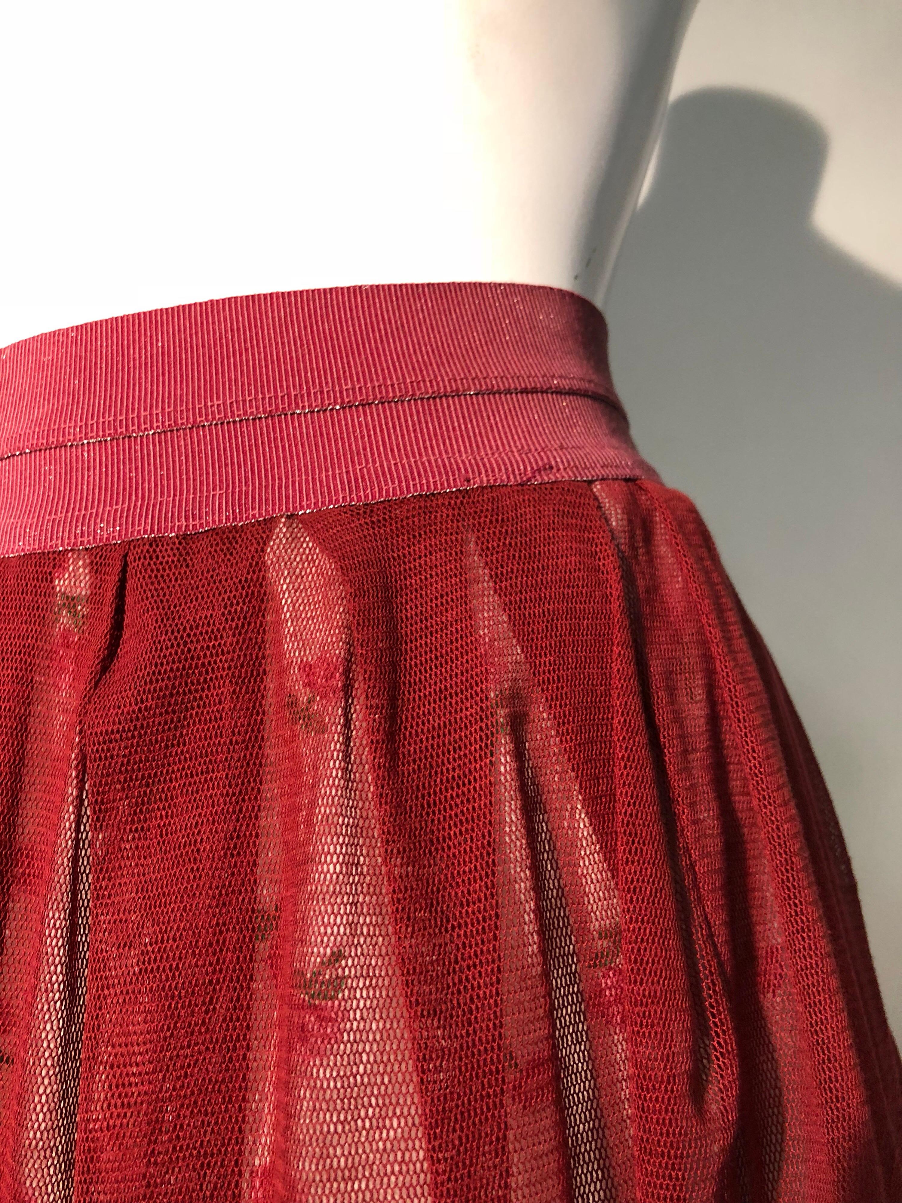A beautiful reconstructed Torso Creations multi-layer petticoat skirt. Fashioned from multiple layers of vintage burgundy tulle and rose floral print, it has been fitted with a wide burgundy elastic waist, and is ready to wear on the town!