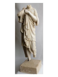 Female torso with white Carrara marble drapery