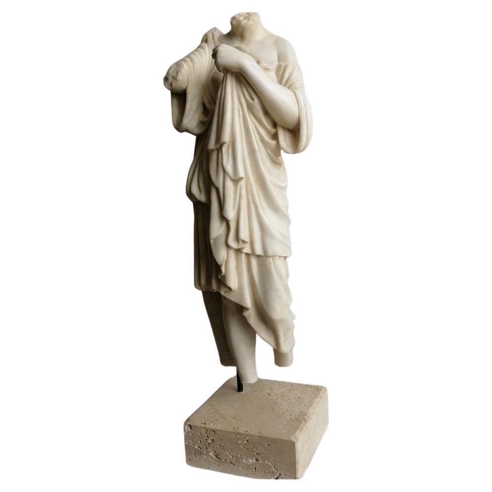 Female torso with white Carrara marble drapery