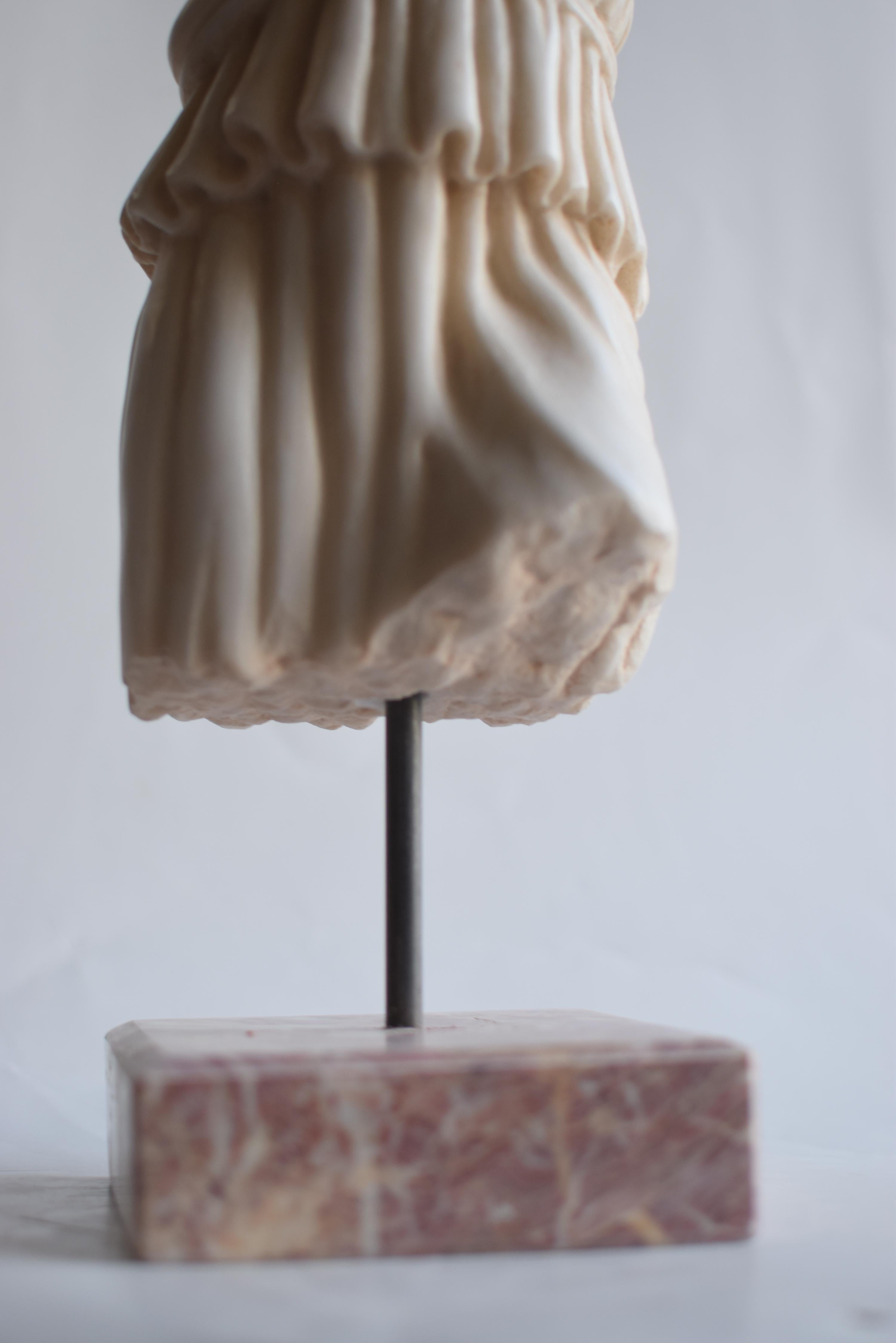 Hand-Crafted Female toga torso carved from white Carrara marble For Sale