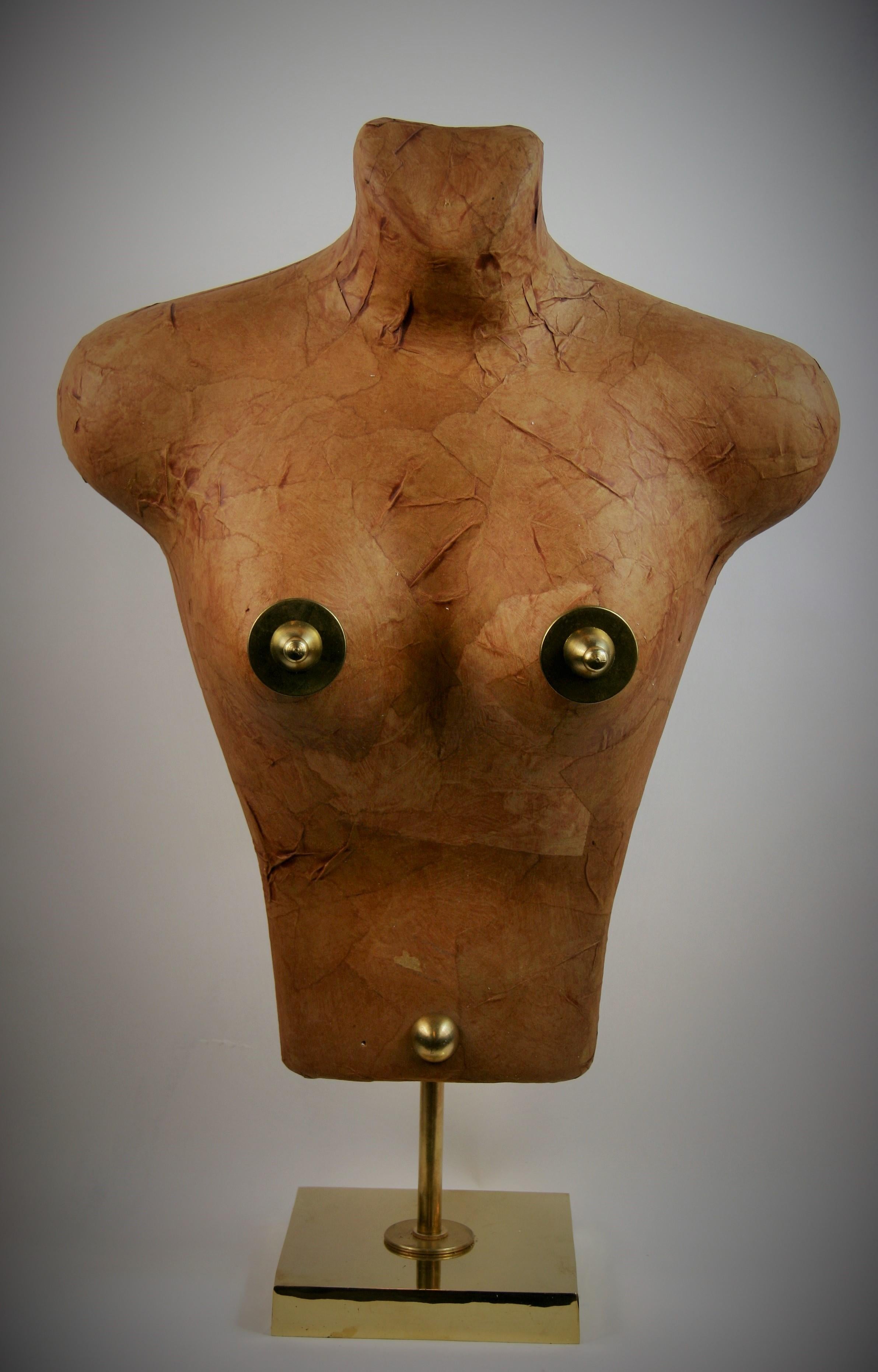 8-273 Torso sculpture made from Japanese paper applied to a foam structure embellished with brass on a
polished brass base created by Brunelli in 1985.