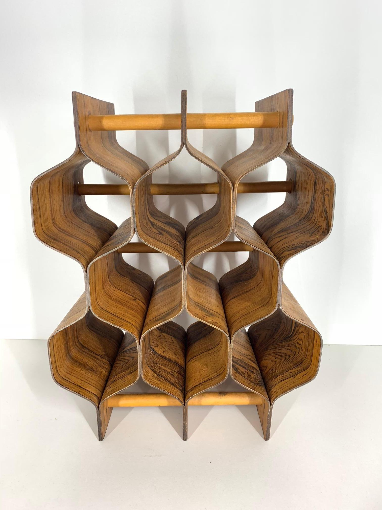 Rosewood wine rack by Swedish designer, Torsten Johansson (1917-1996) for Ab Formträ. Holds 8 bottles. Signed. Excellent example of Minimalist Mid-Century Modern design. Very good condition with one slight discoloration on rear corner of lower level