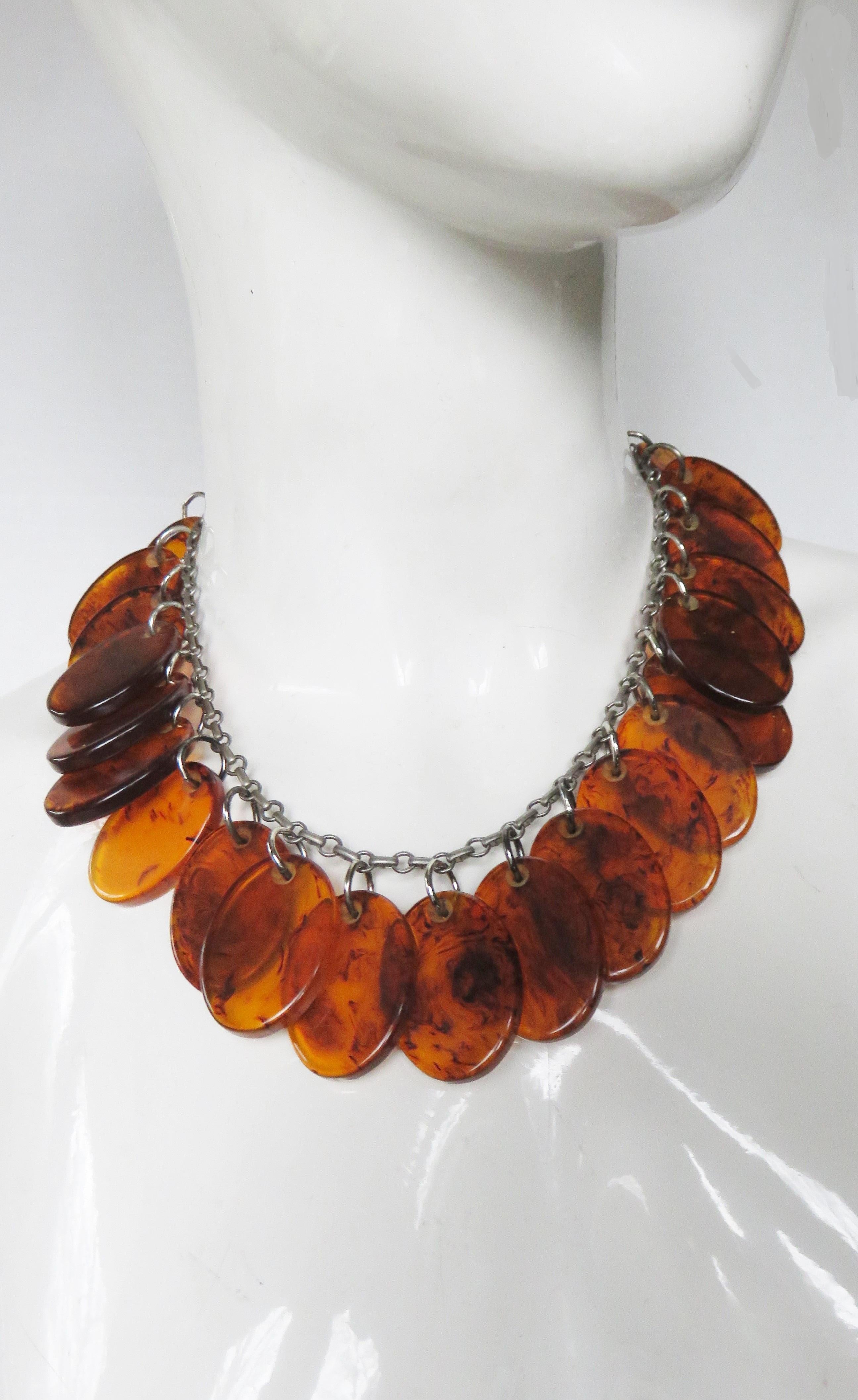 A gorgeous faux tortoise shell Bakelite disc necklace.  Attached to an 18