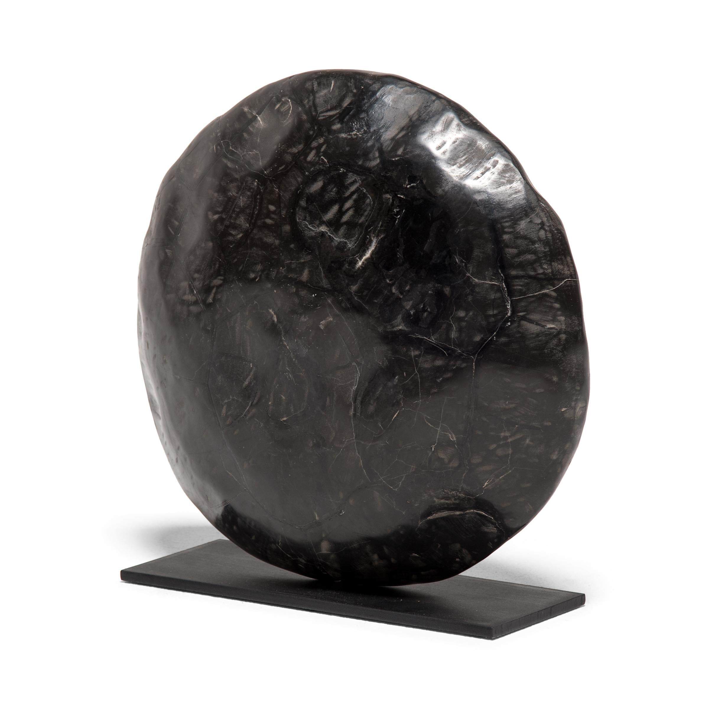 Sourced from Guangxi province, this round stone looks just like the shell of a tortoise, a traditional emblem of longevity. The unusual stone was formed by the cracking of sedimentary stones, which was then filled by deposits of another mineral. The