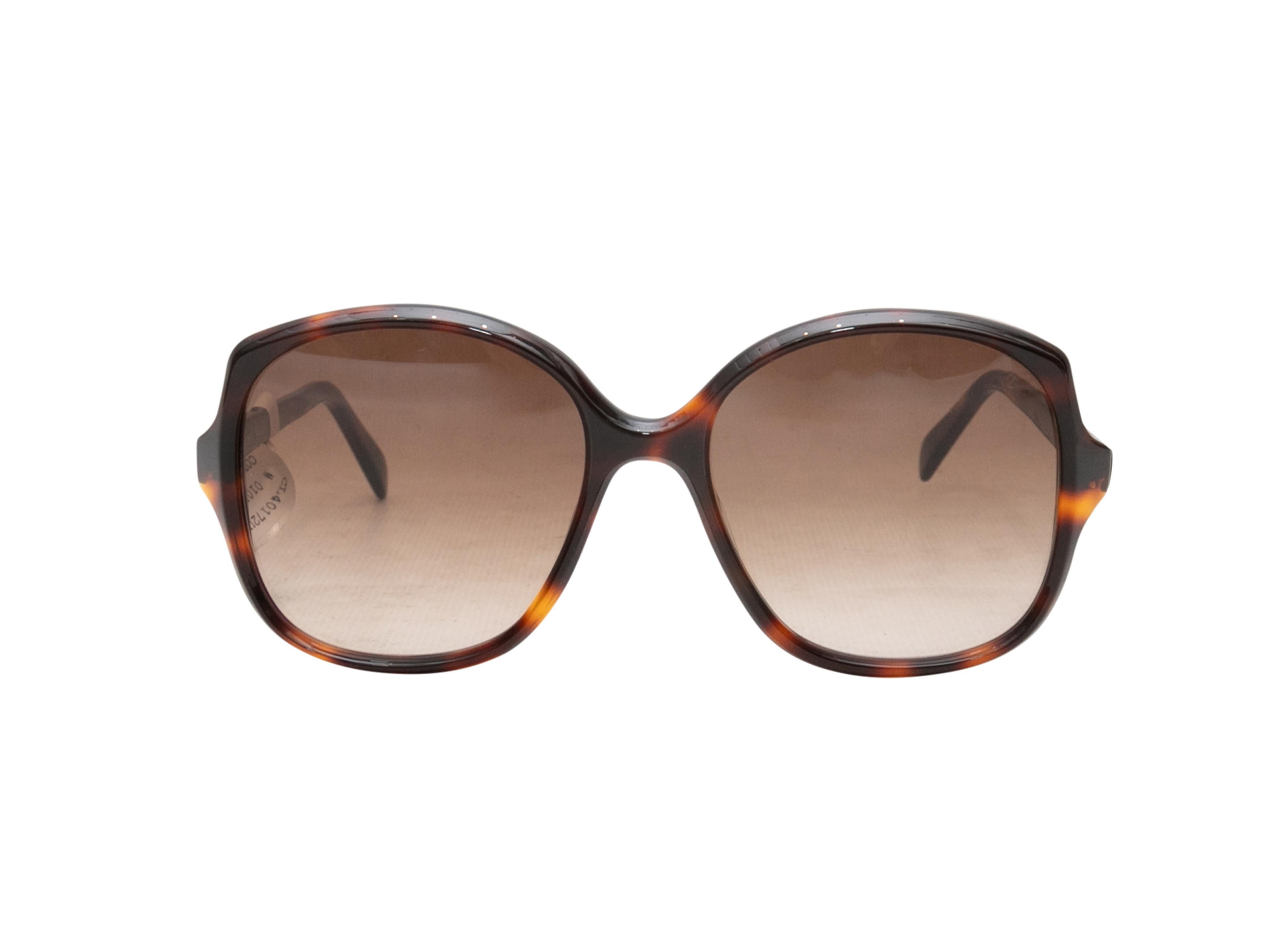 Tortoiseshell acetate oversized sunglasses by Celine. Brown tinted lenses. 2.5