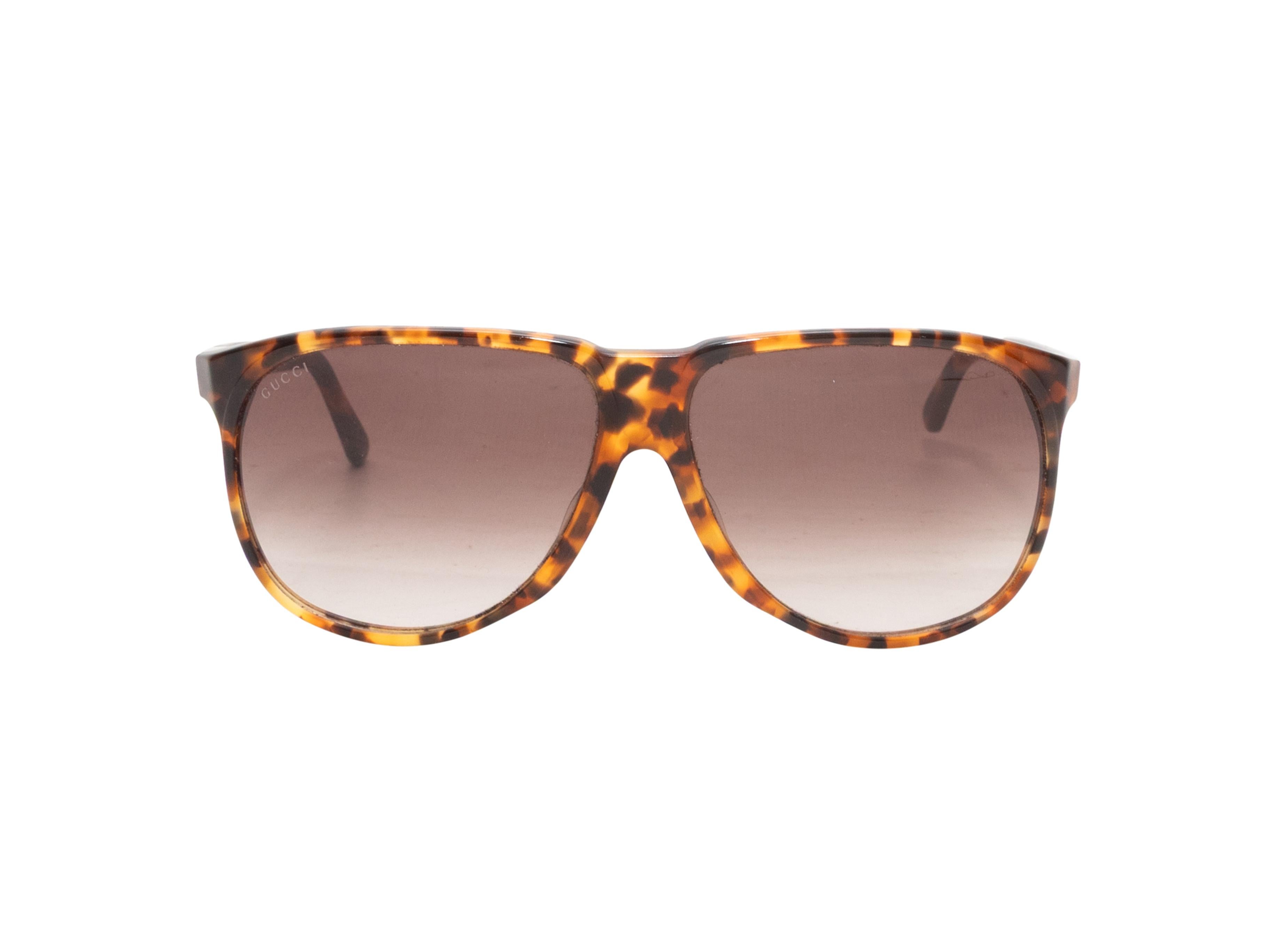 Occhiali da sole aviator in acetato tartarugato di Gucci. Lenti colorate marroni. Altezza 2,25
