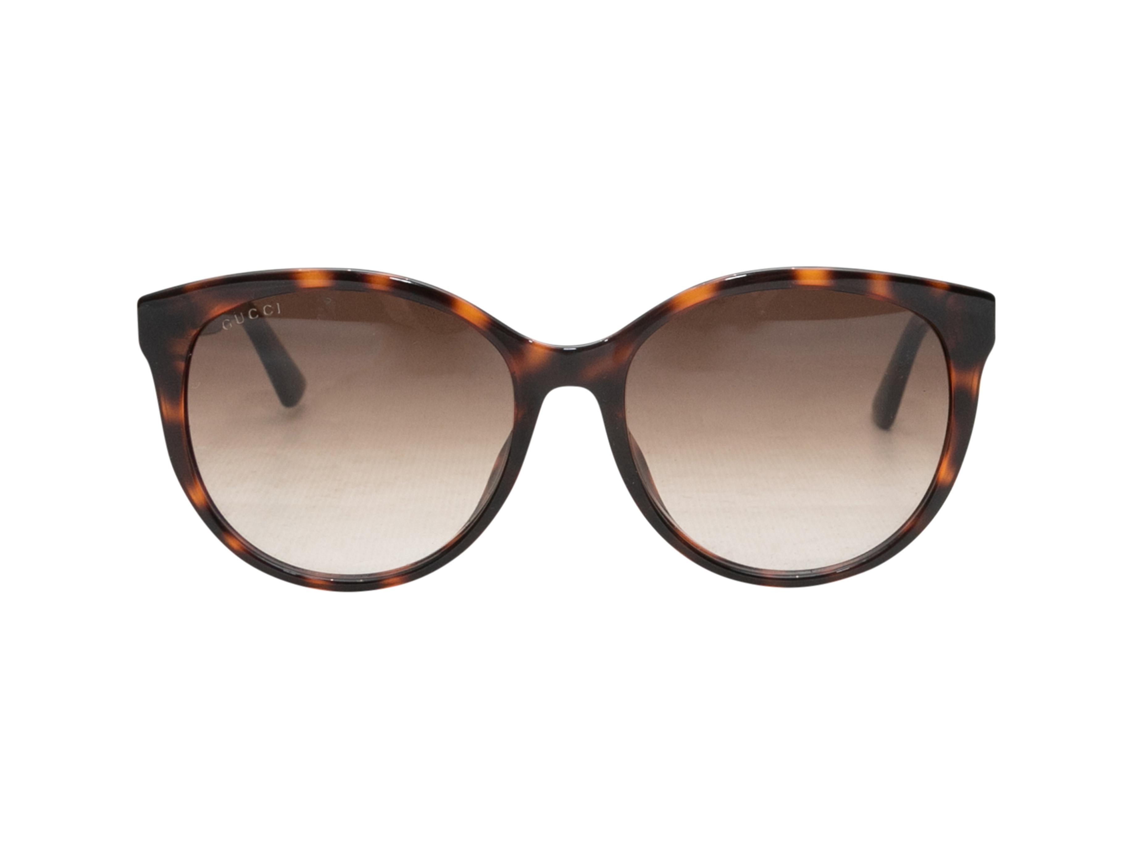  Occhiali da sole in acetato tartarugato di Gucci. Lenti colorate marroni. Altezza 2,25