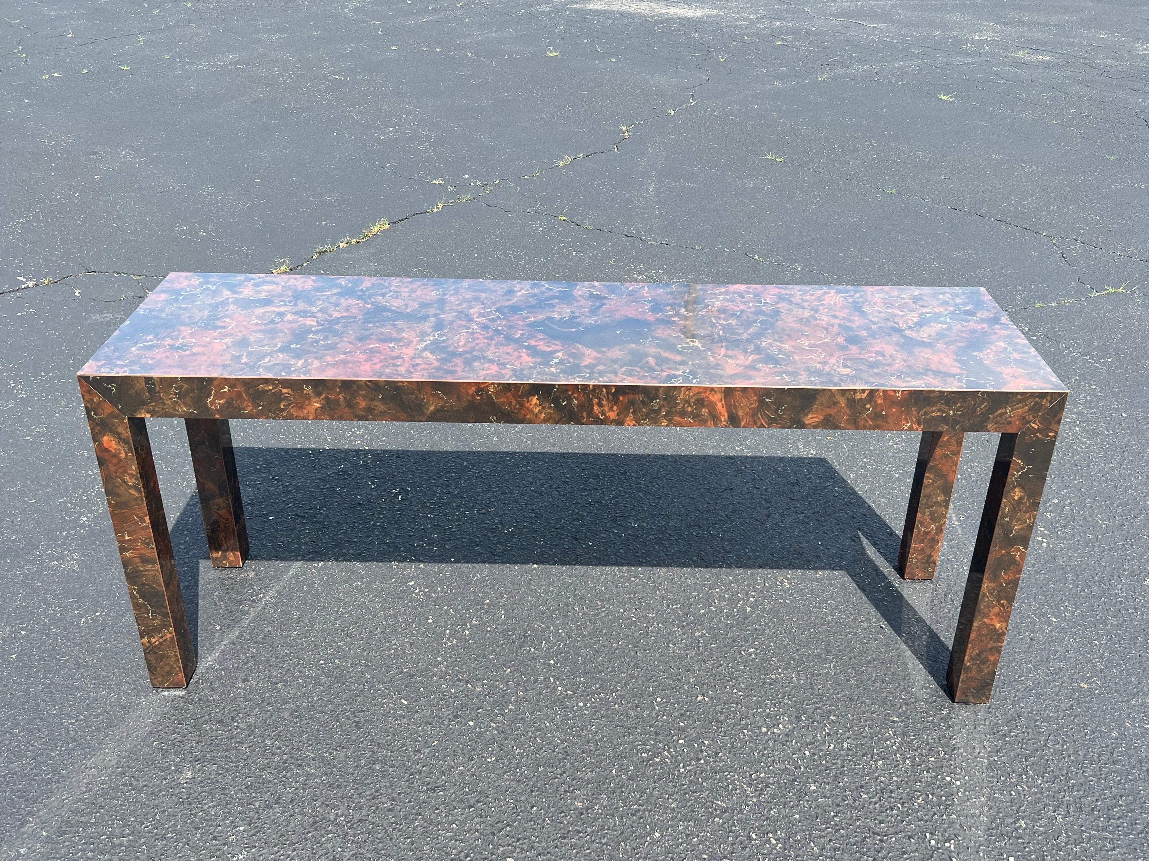 Tortoiseshell Laminate Parsons Sofa Table. Nice jeweled earth tones , in excellent condition. Matching coffee table and two end tables are also available.