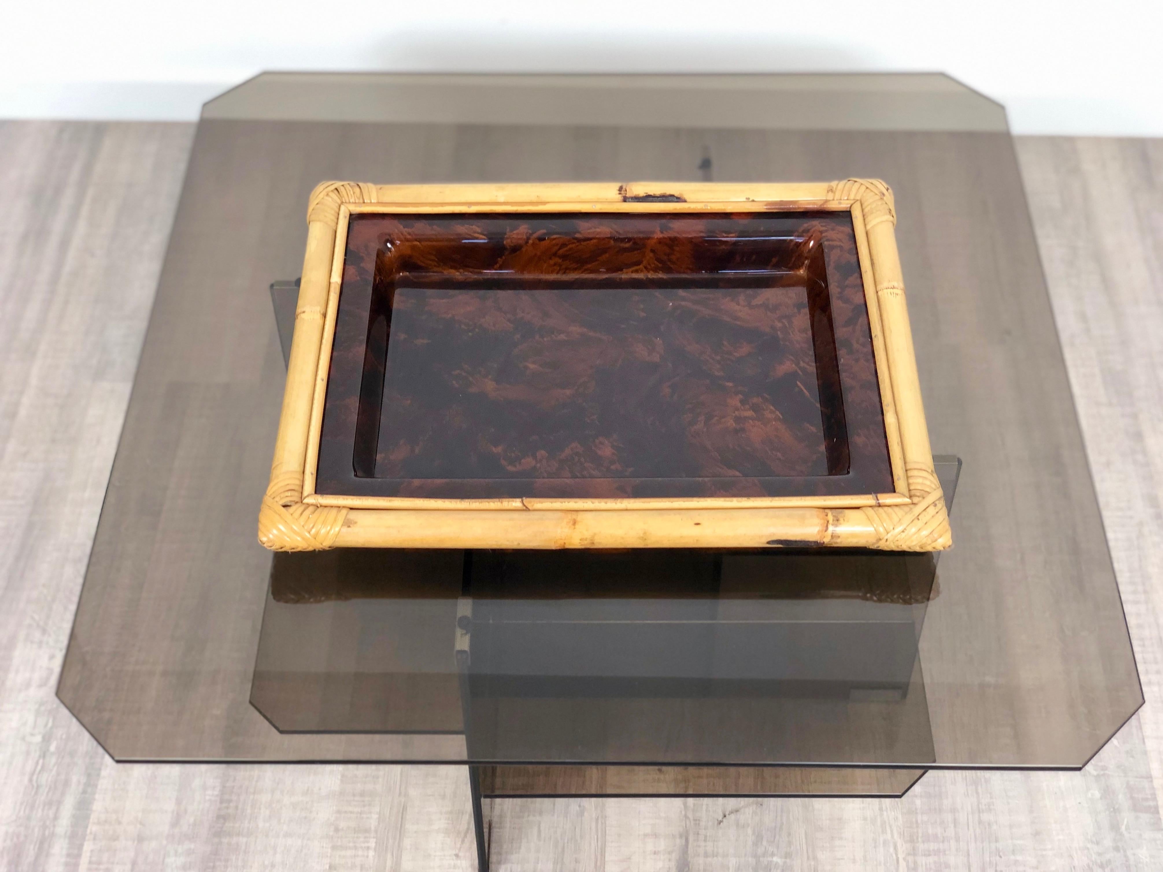 Serving tray in tortoiseshell Lucite and bamboo frame. Typical item from the Italian's 1970s.