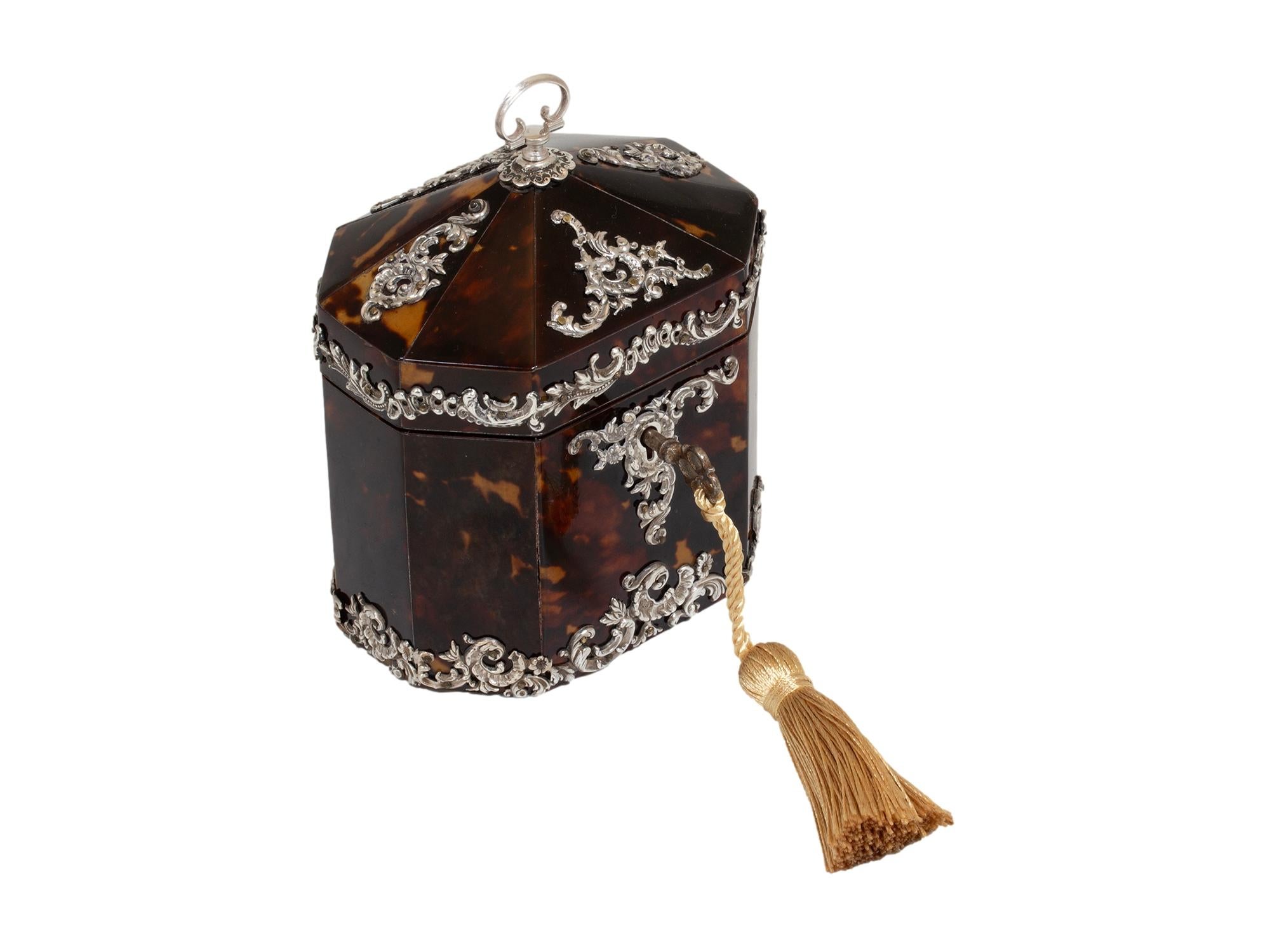 FREE WORLDWIDE SHIPPING

With Mounted Intricate Silver Work 

From our Tea Caddy collection, we are delighted to offer this Victorian Tortoiseshell & Silver Mounted Tea Caddy by silversmiths Deakin & Francis Ltd.

The tent top Tea caddy of octagonal