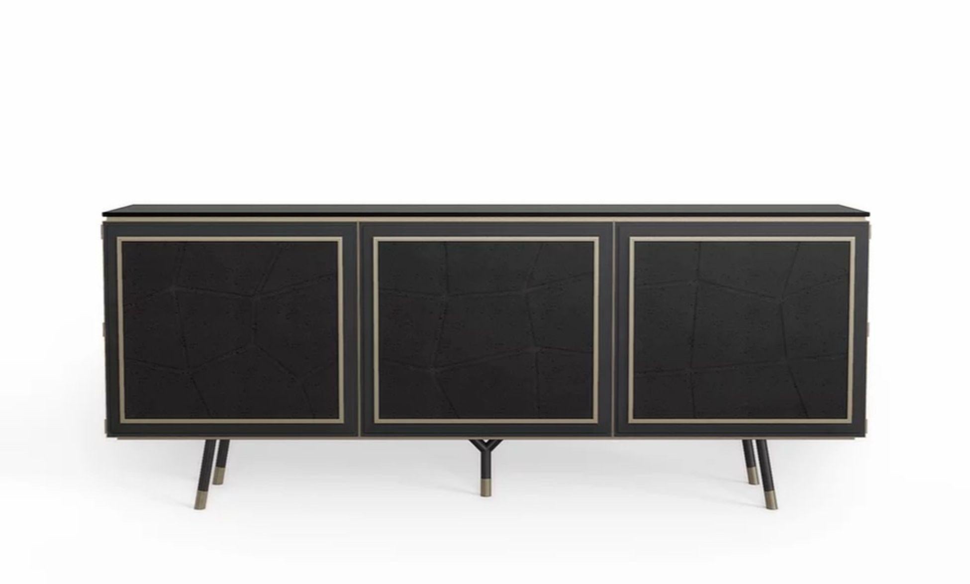 Tortuga cabinet by Marmi Serafini
Materials: Pietra Lavica Nera, bronze brass, leather, wood
Dimensions: D 47 x W 210 x H 83 cm

Pietra Lavica is granite which recalls the earth and its different formations. That is why, this peculiar feature is