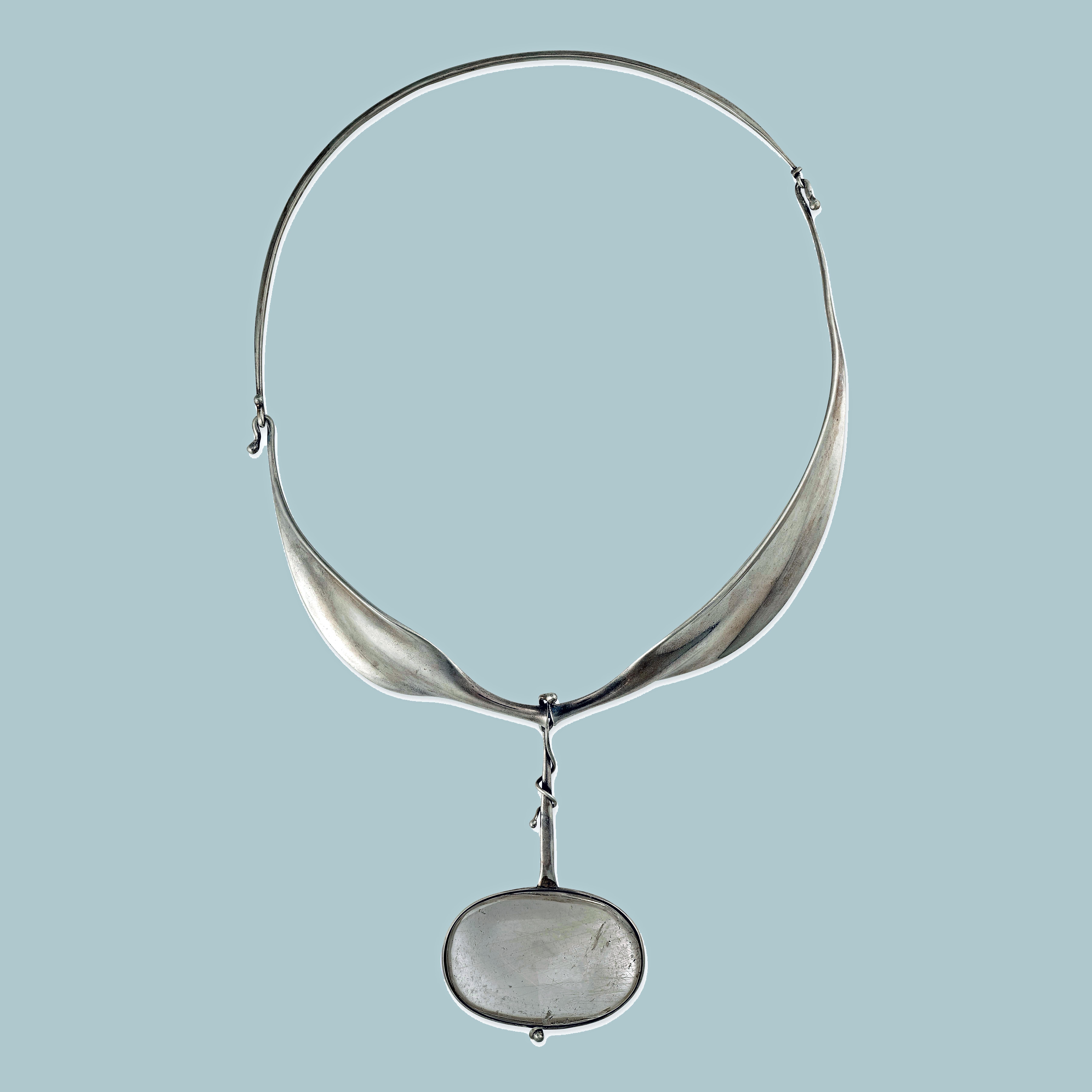 Vivianna Torun Bulow Hube for George Jensen, a rare silver rutilated quartz pendant on collar, Denmark, C. 1975, #242, stamped Georg Jensen in a dotted oval, Denmark, Torun, 242 and 925S. Will fit up to 19-inch neck, pendant drop approximately 3