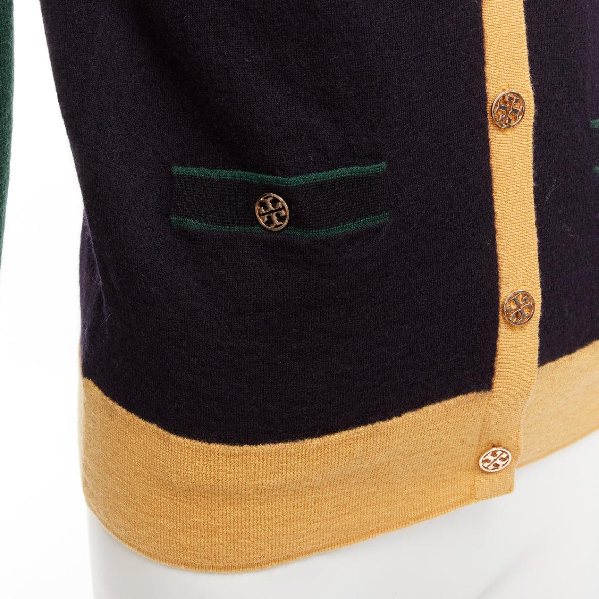 TORY BURCH 100% merino wool colorblocked logo button cardigan sweater M
Reference: KYCG/A00016
Brand: Tory Burch
Material: Merino Wool
Color: Black, Green
Pattern: Solid
Closure: Button
Extra Details: Logo buttons.
Made in: