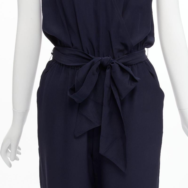 TORY BURCH 100% silk navy V neck wide leg wrap tie wide leg jumpsuit XS
Reference: SNKO/A00418
Brand: Tory Burch
Material: Silk
Color: Navy
Pattern: Solid
Closure: Elasticated
Made in: China

CONDITION:
Condition: Excellent, this item was pre-owned
