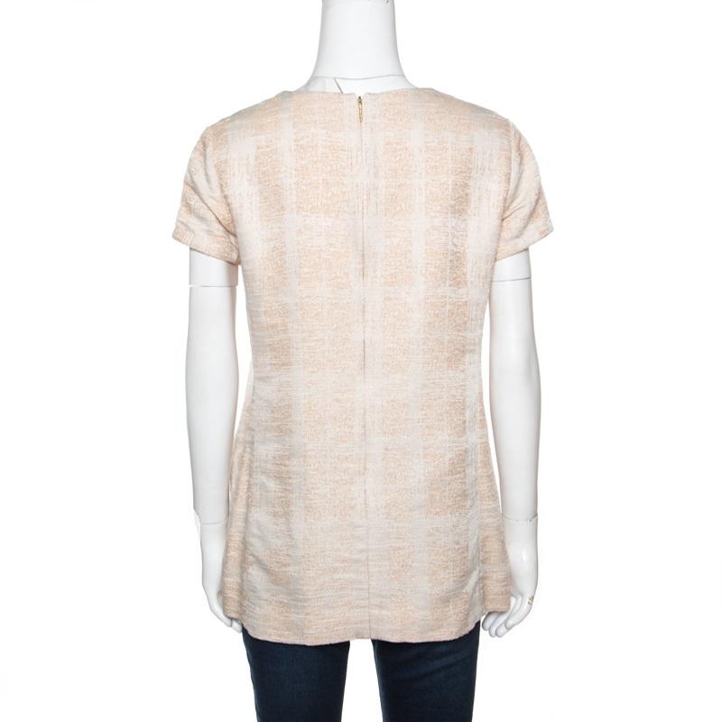 One glance and you'll fall in love with this fabulous tunic from Tory Burch. The tunic is made from quality fabrics, and it flaunts a round neckline, short sleeves and embellishments on the pockets.

Includes: The Luxury Closet Packaging

