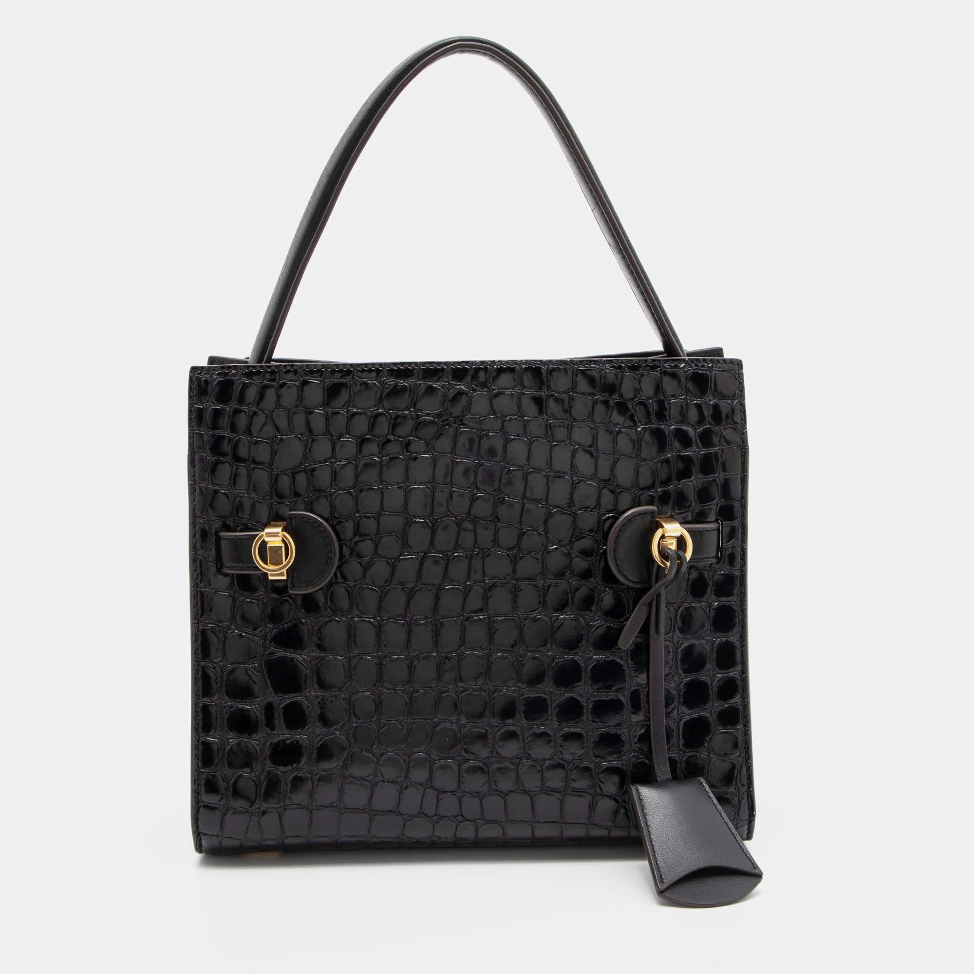 Functional and stylish, this designer label's collections capture the effortless, elegant finesse of the modern woman. Crafted from quality materials, this chic bag is easy to carry and can fit in your daily essentials effortlessly.

Includes: