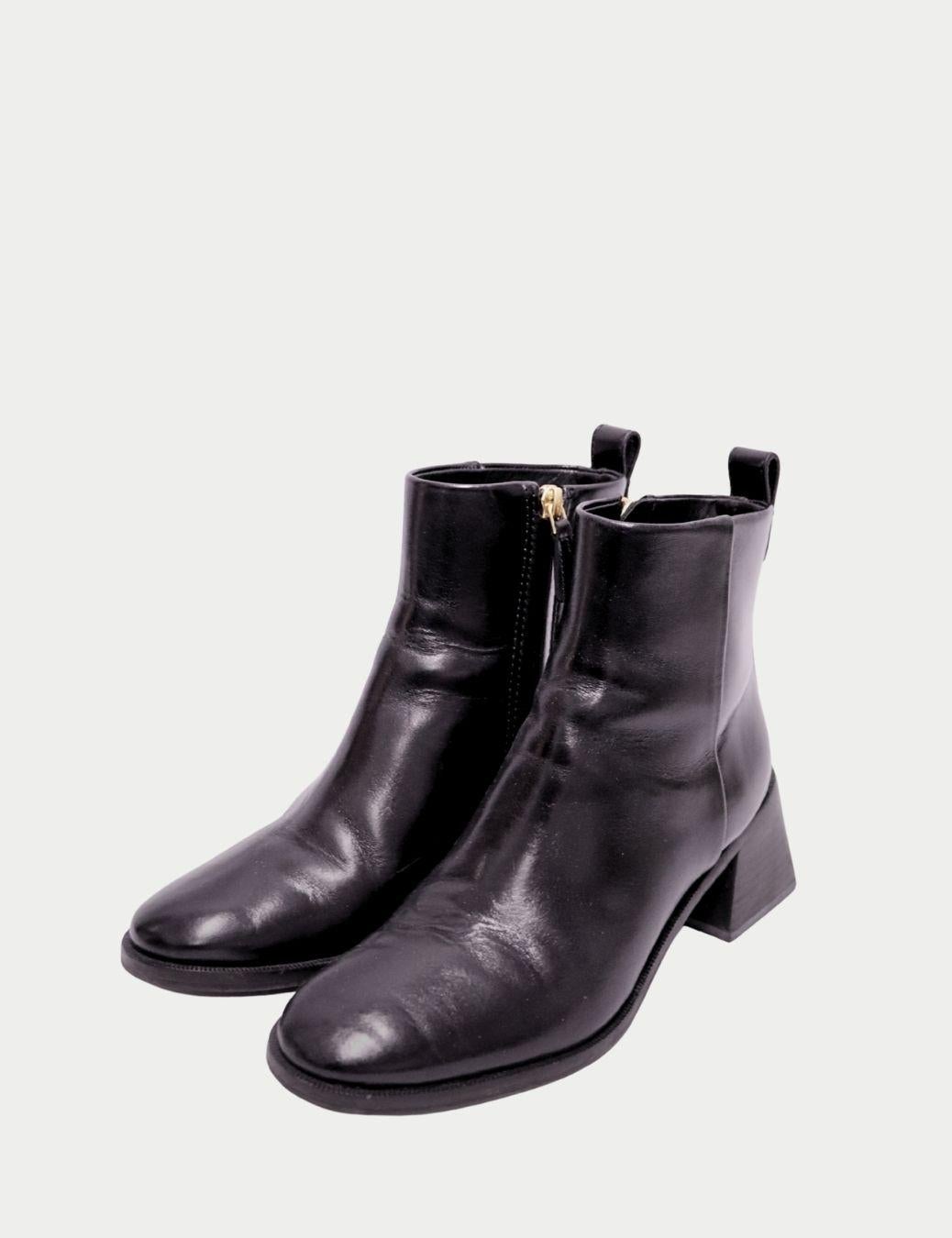 Tory Burch Black Leather Ankle Boots with Block Heel

These Tory Burch black leather ankle boots are the perfect blend of polished style and everyday practicality. Crafted from smooth black leather, the boots feature a sleek round toe, a comfortable