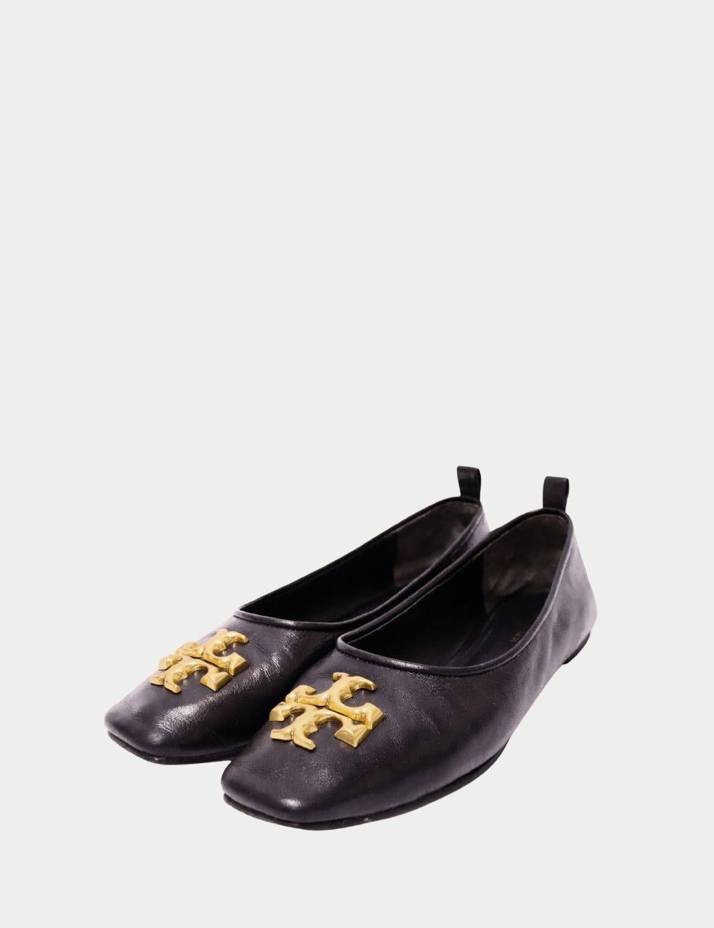 Tory Burch Black Leather Ballet Flats with Gold Logo

Classic, versatile, and effortlessly chic — these Tory Burch black leather ballet flats are a timeless wardrobe staple. Crafted in smooth black leather, the flats feature the brand’s iconic