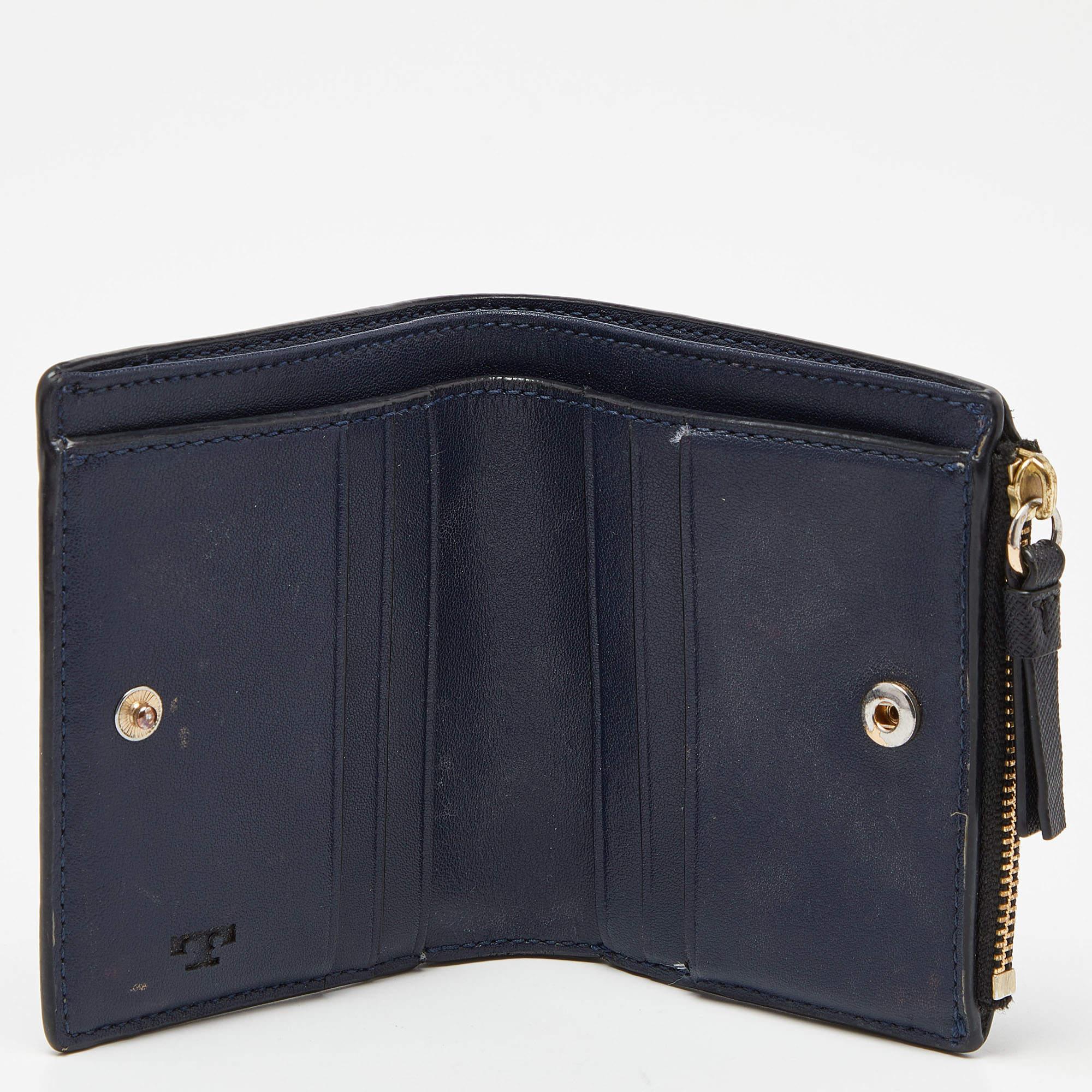 Elevate your everyday elegance with this Tory Burch wallet. Meticulously crafted from premium materials, it seamlessly blends style, functionality, and sophistication, making it a great pick