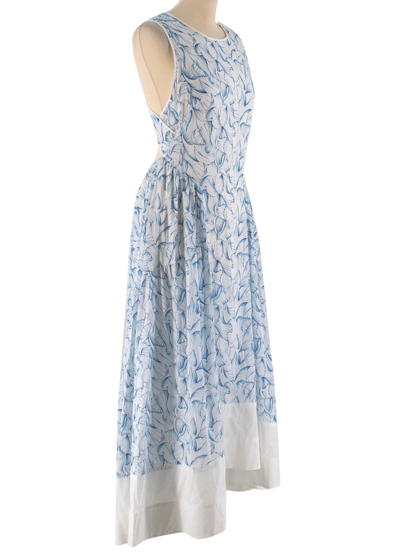Tory Burch Blue and White Pattern Summer Dress

- Cotton full length summer dress
- Sleeveless with a round neckline
- Open back with crossover straps
- Zip fastening with adjustable waist and tassel detail
- Exterior and interior 100%