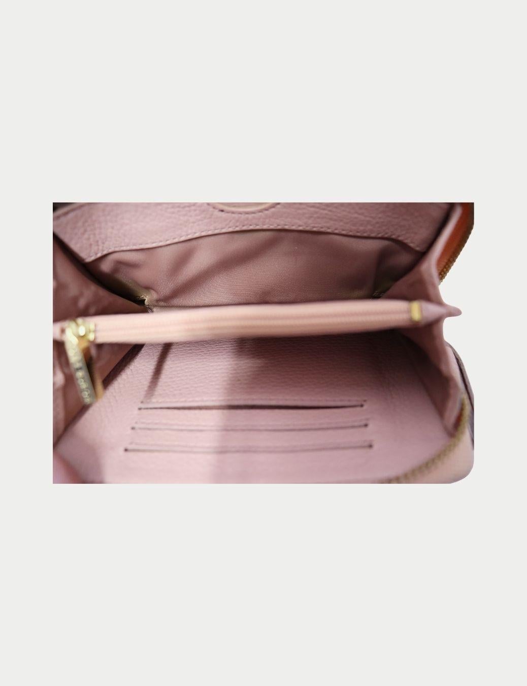 Tory Burch Portefeuille zippé en cuir rose blush Pour femmes en vente